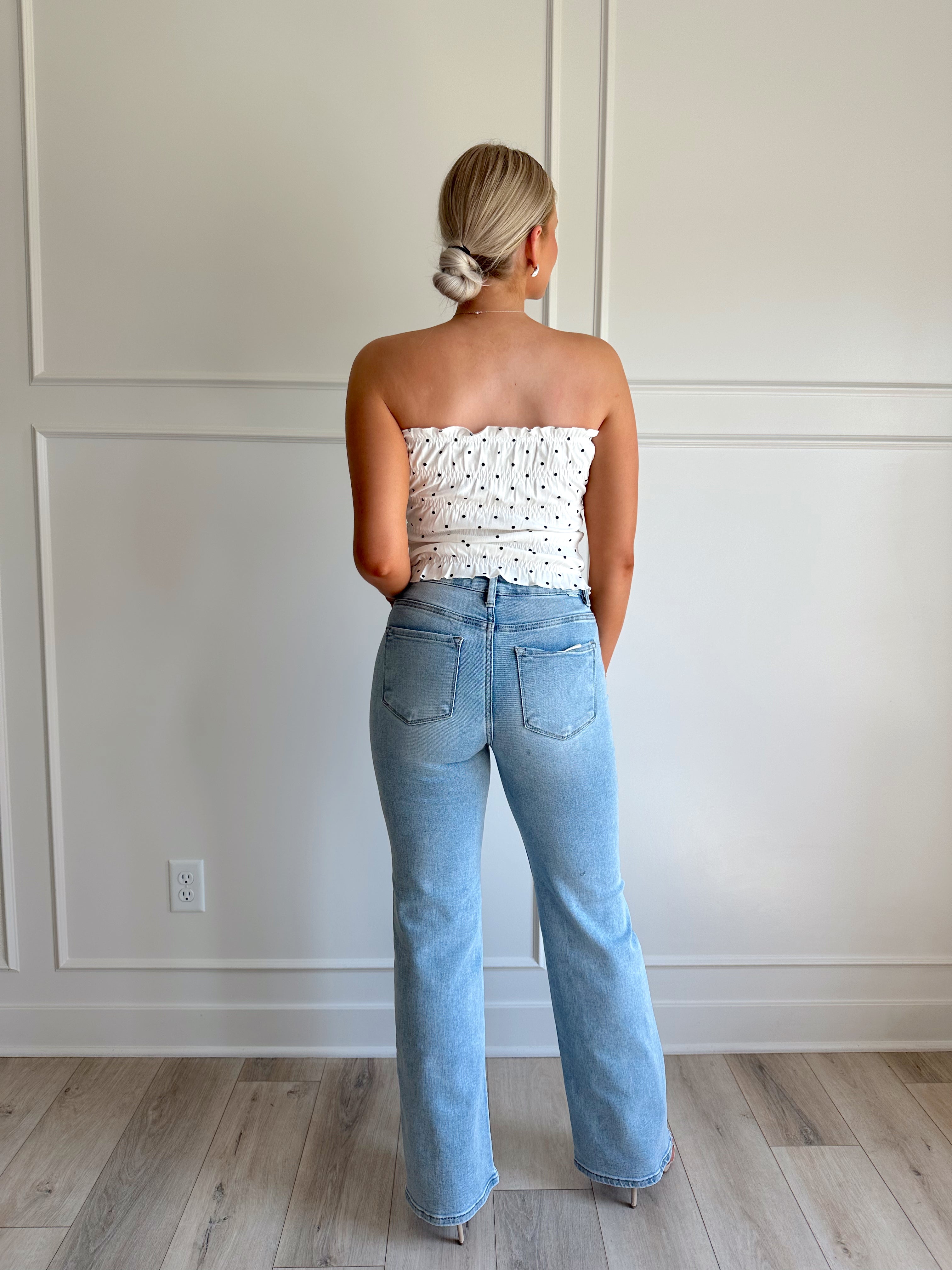 White smocked polka dot tube top with tiered elastic.