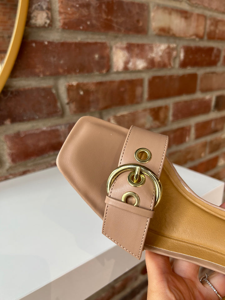 Open toed tan kitten heel with buckle detail.