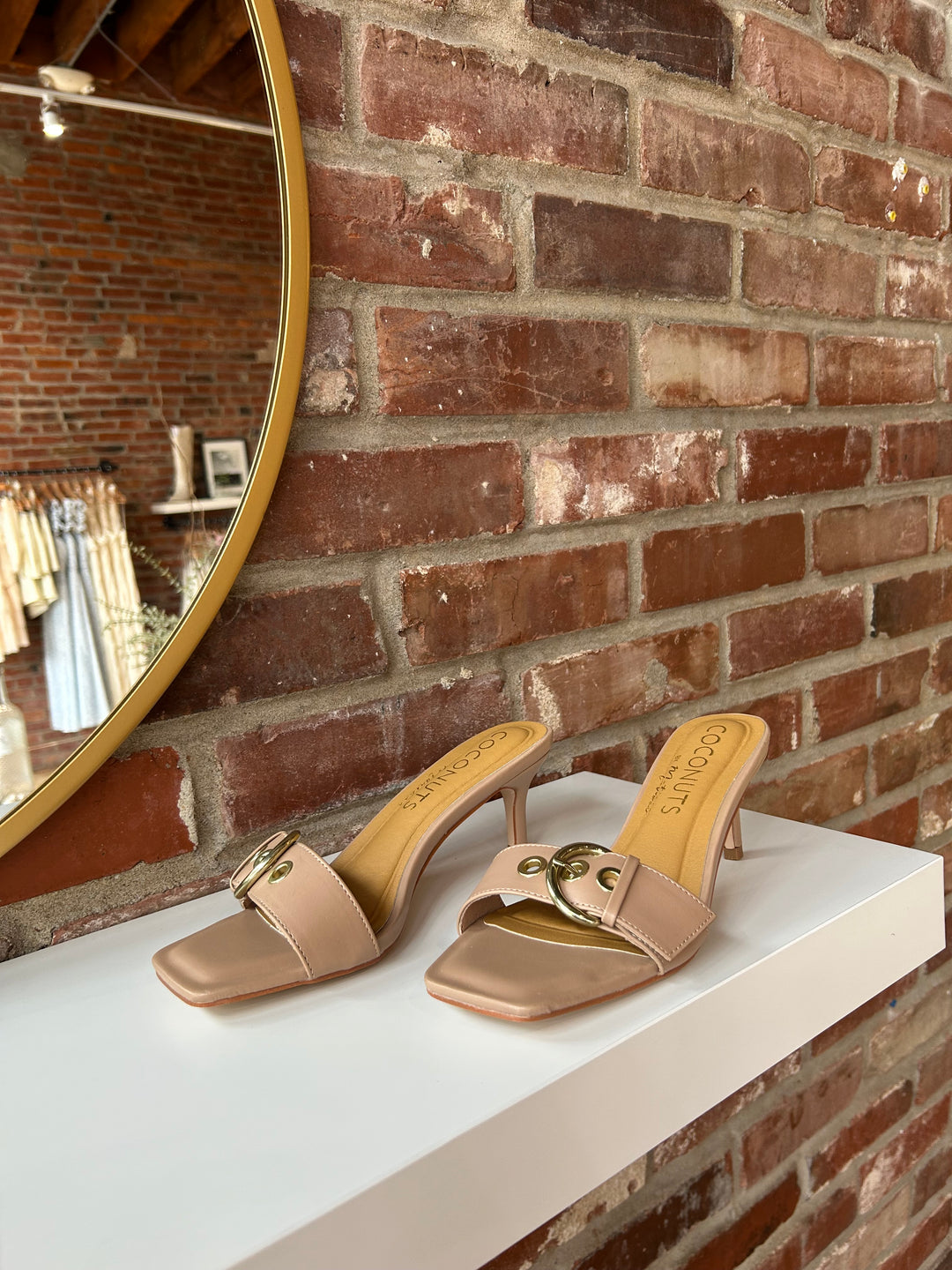 Open toed tan kitten heel with buckle detail.