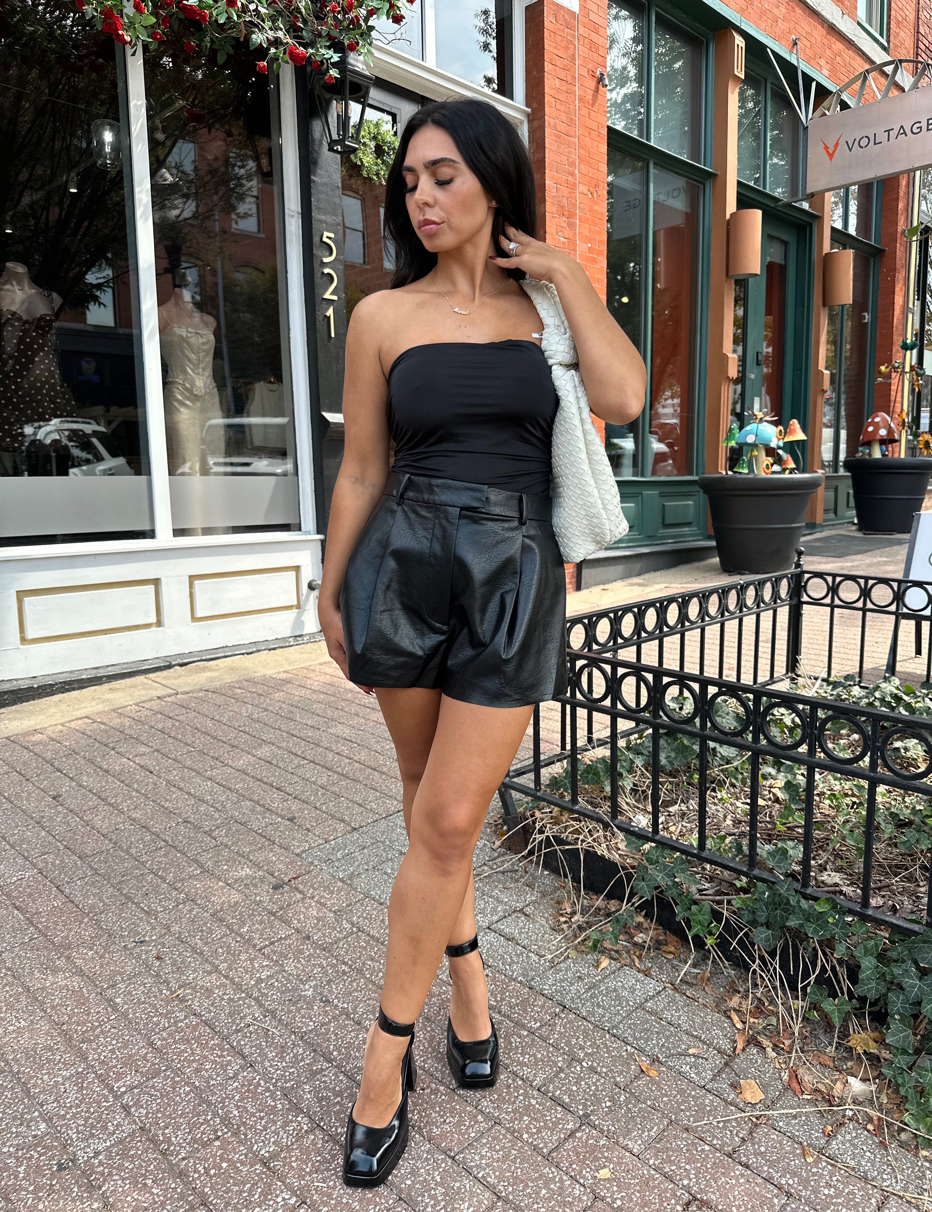 Black tube top with ruched sides.