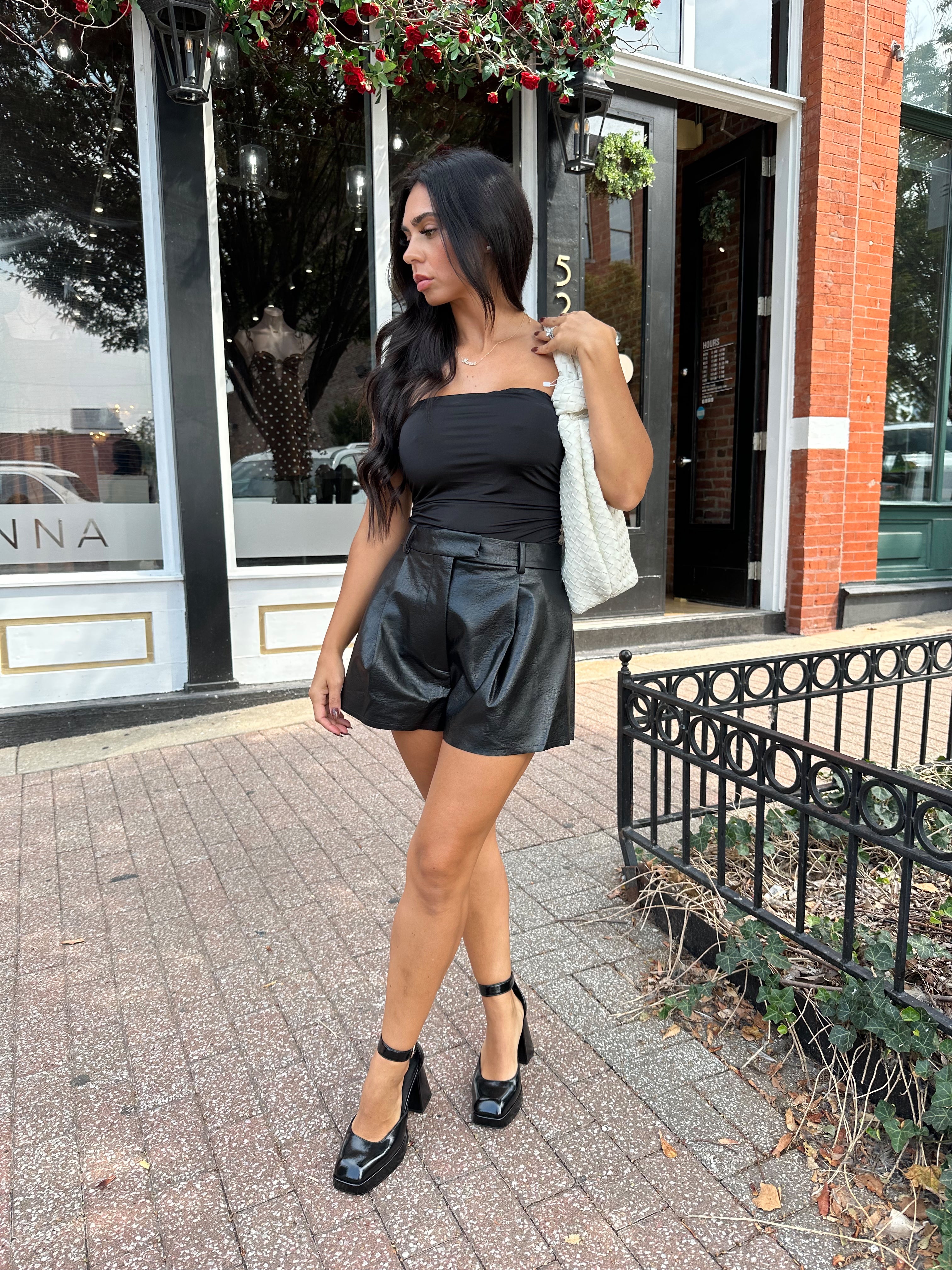 Black tube top with ruched sides.