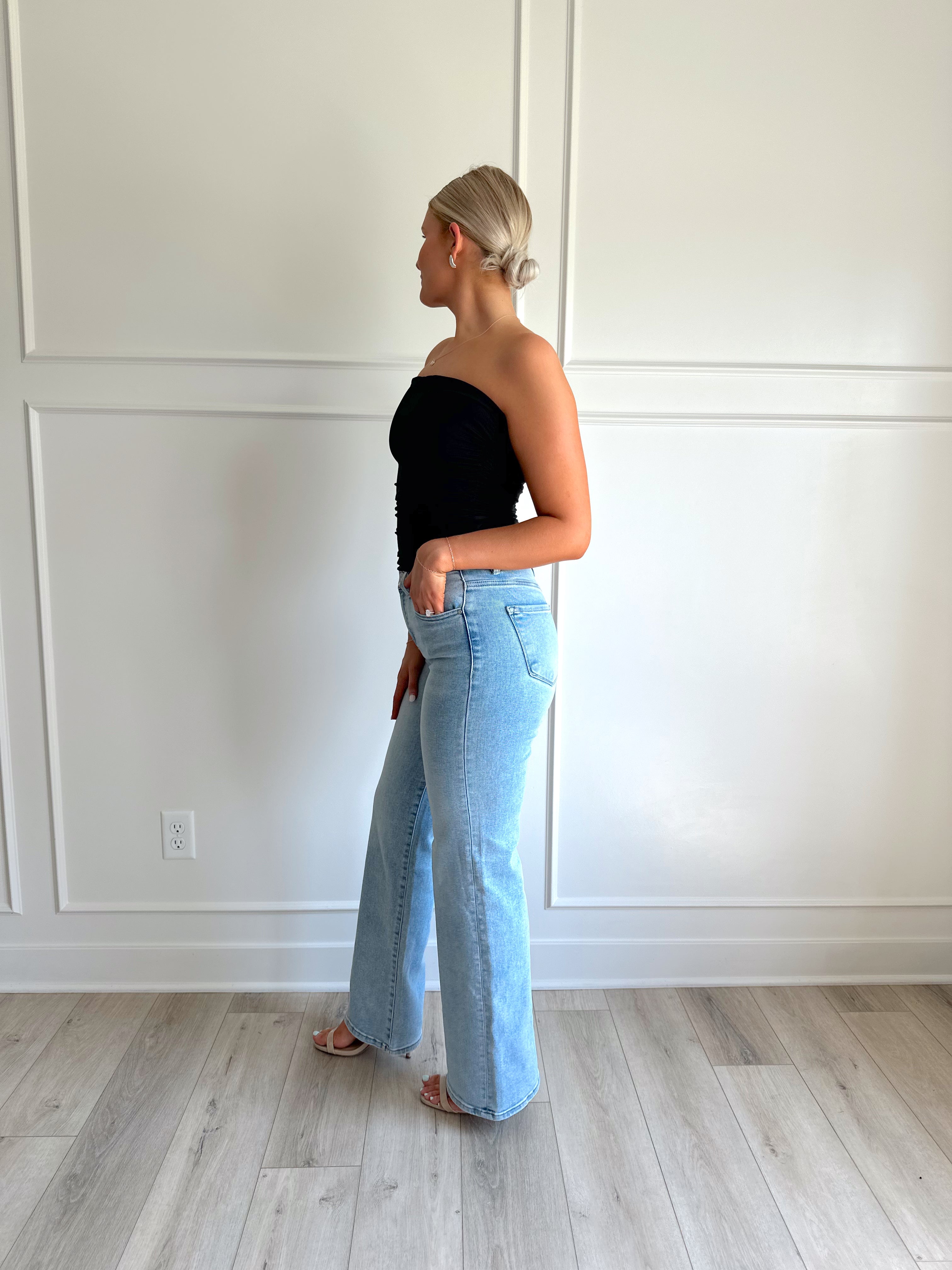Black tube top with ruched sides.