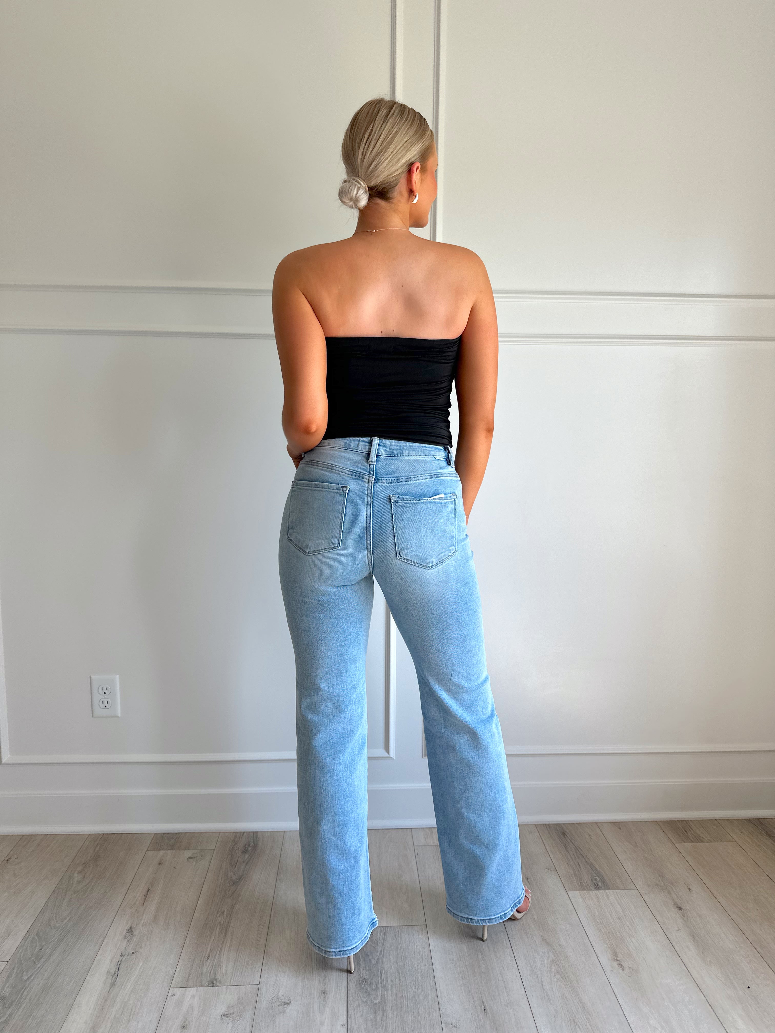 Black tube top with ruched sides.