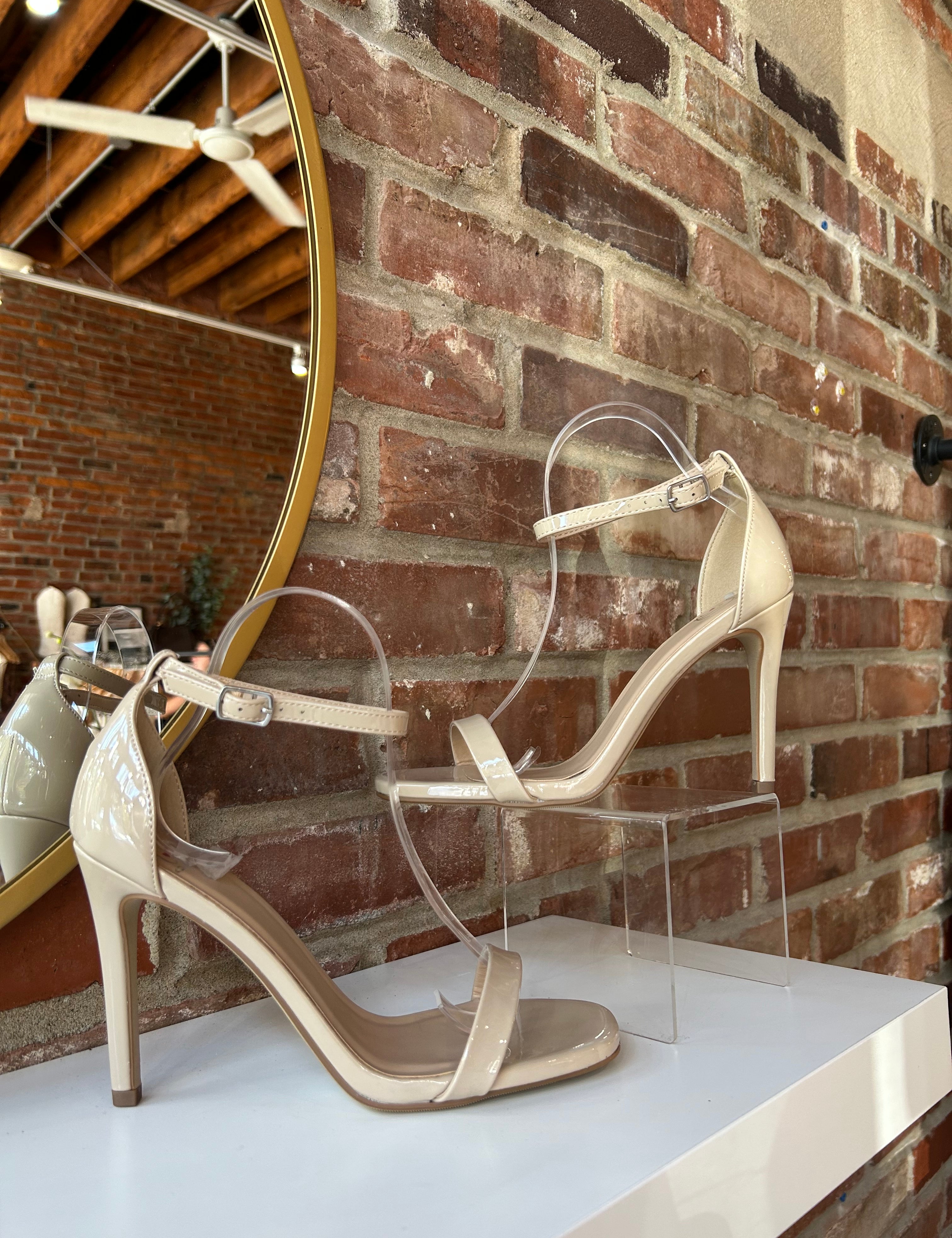 Nude patent open toe heel with slim ankle strap and stiletto high heel