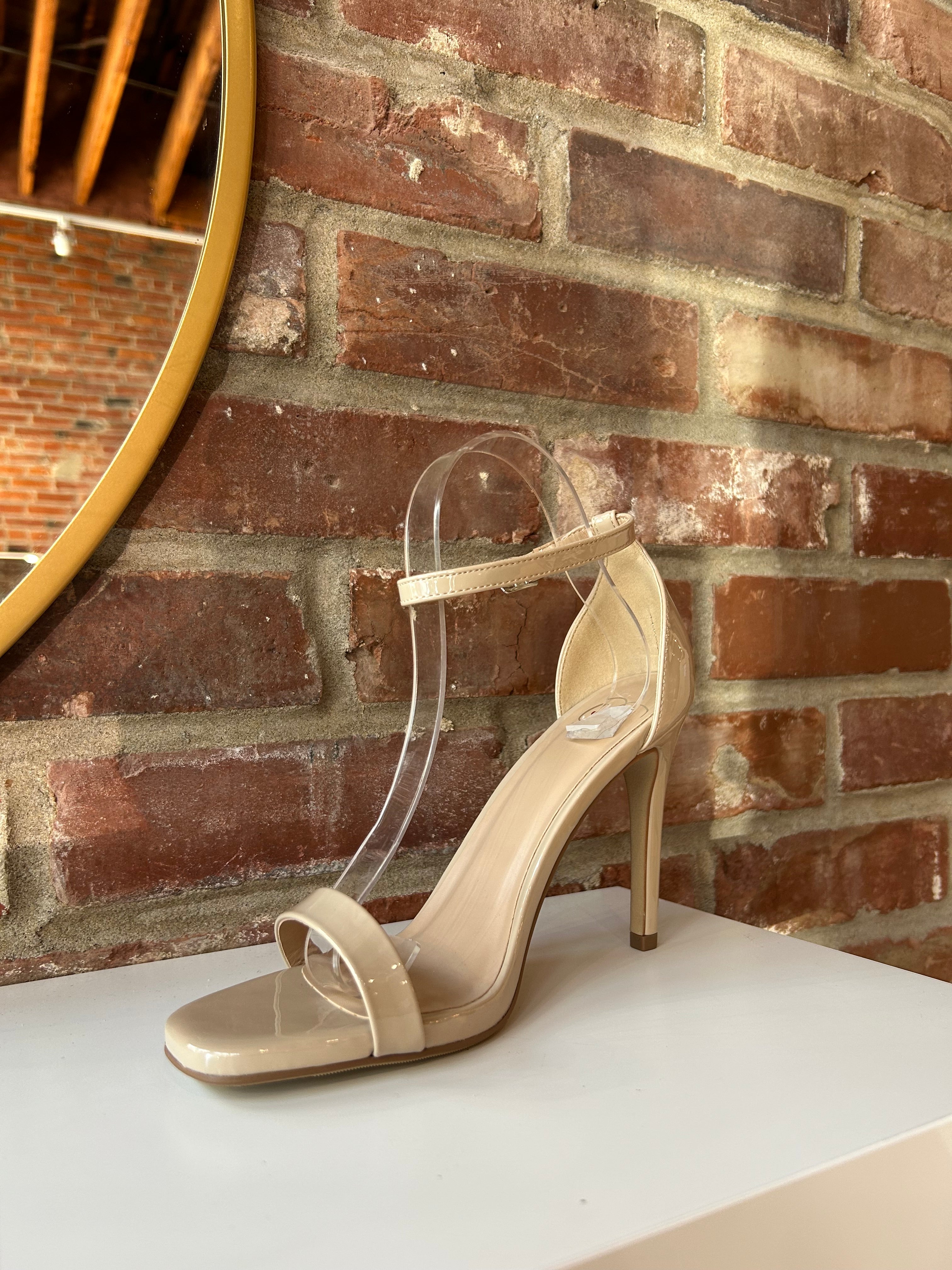 Nude patent open toe heel with slim ankle strap and stiletto high heel