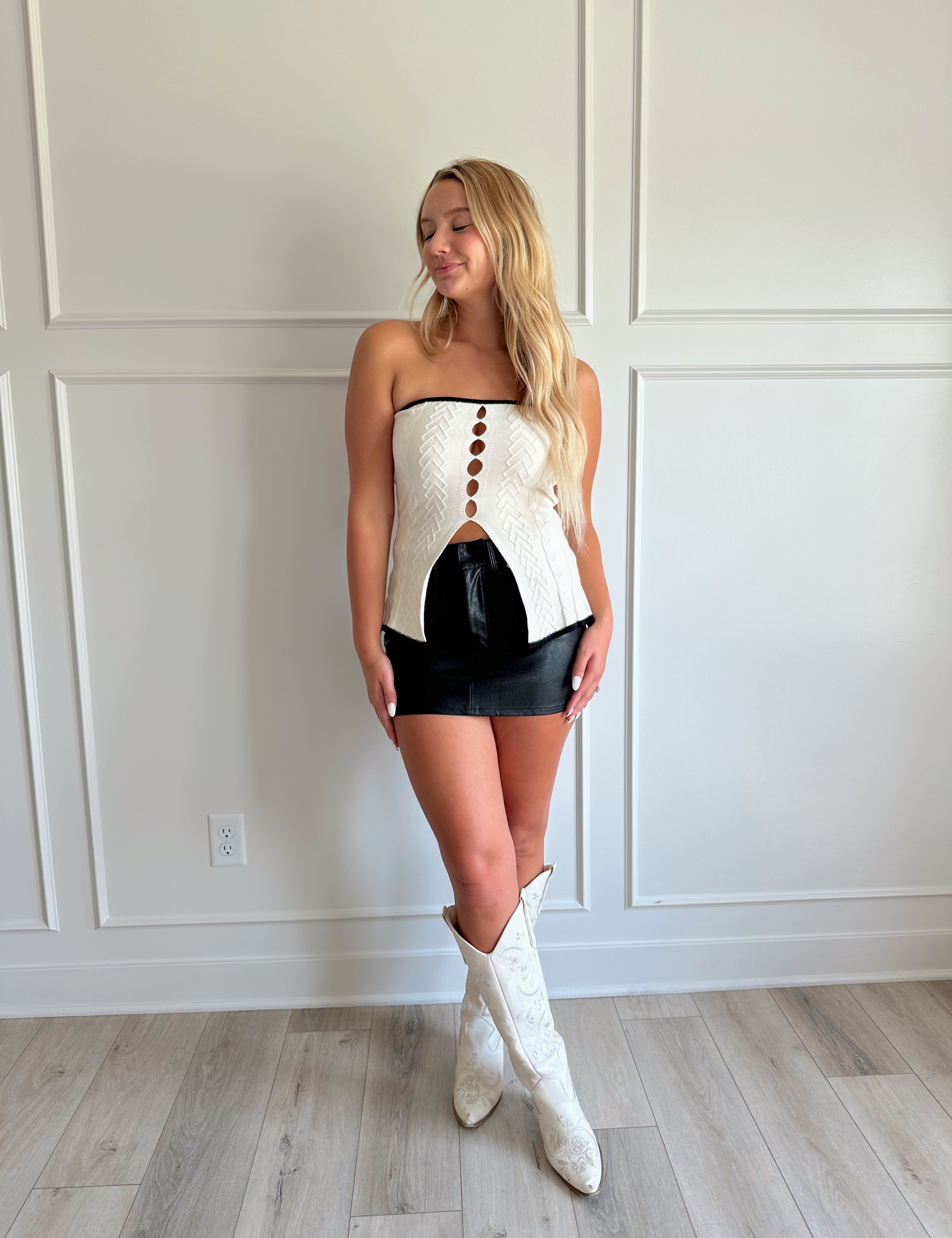 Black vegan leather mini skirt with functional belt loops.