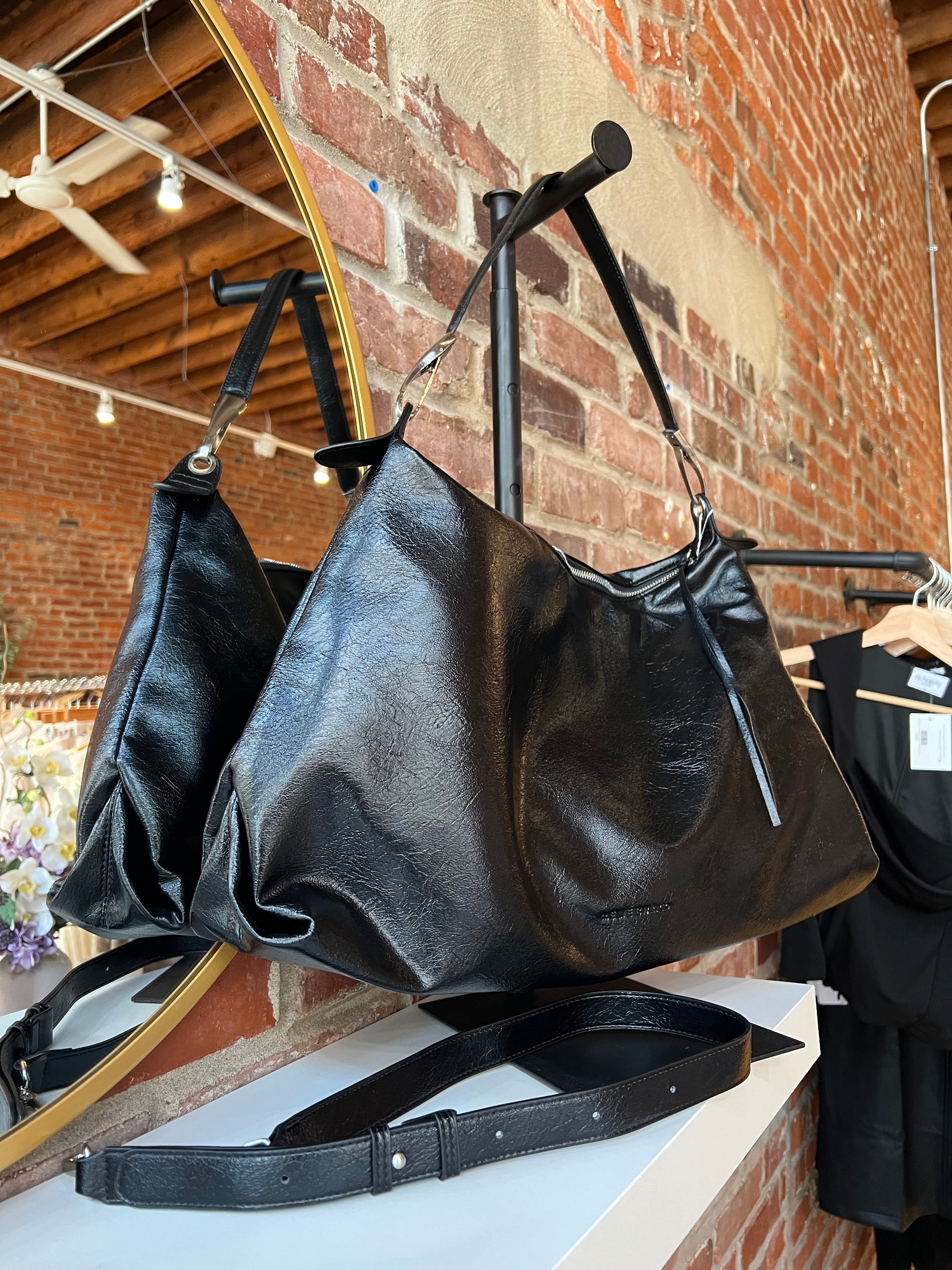 Lowen Black Leather Shoulder Bag with short shoulder strap and adjustable long crossbody strap