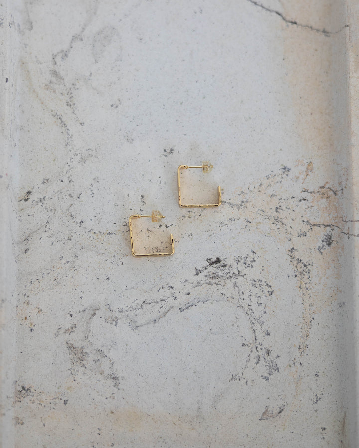 Gold plated textured square hoop earring. 