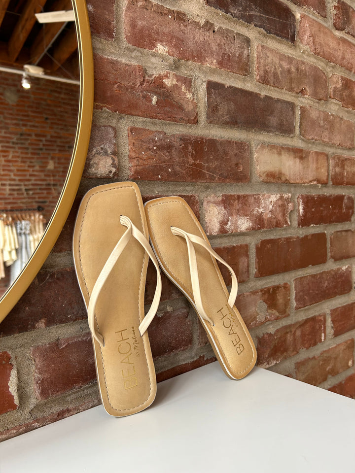 Everyday tan, square toe flip flop. 