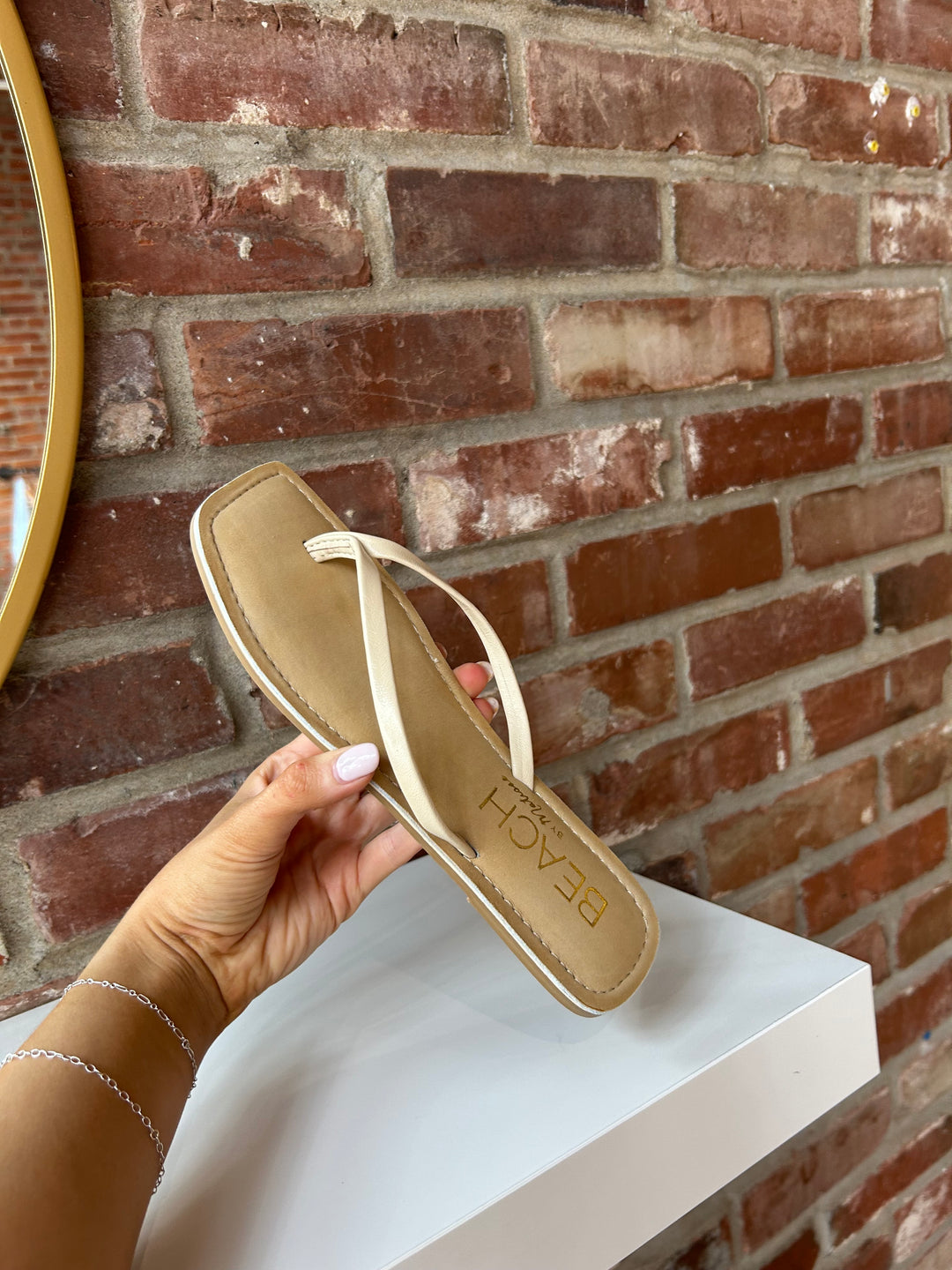 Everyday tan, square toe flip flop. 