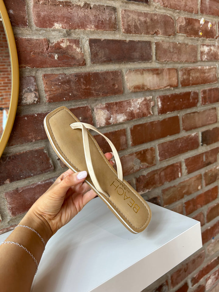 Everyday tan, square toe flip flop. 