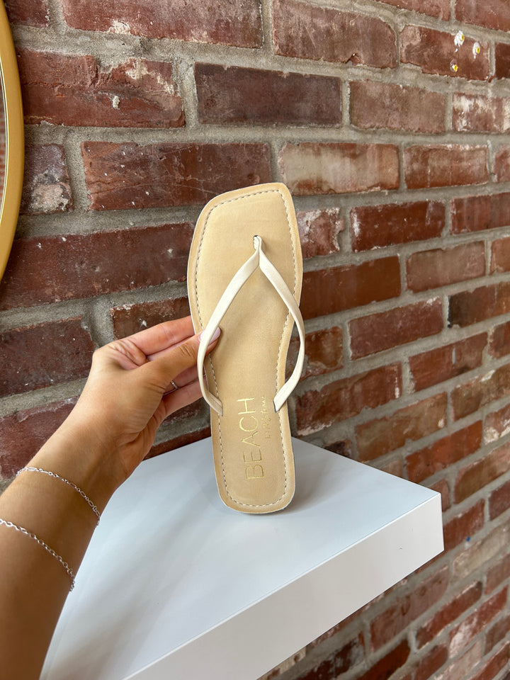 Everyday tan, square toe flip flop. 