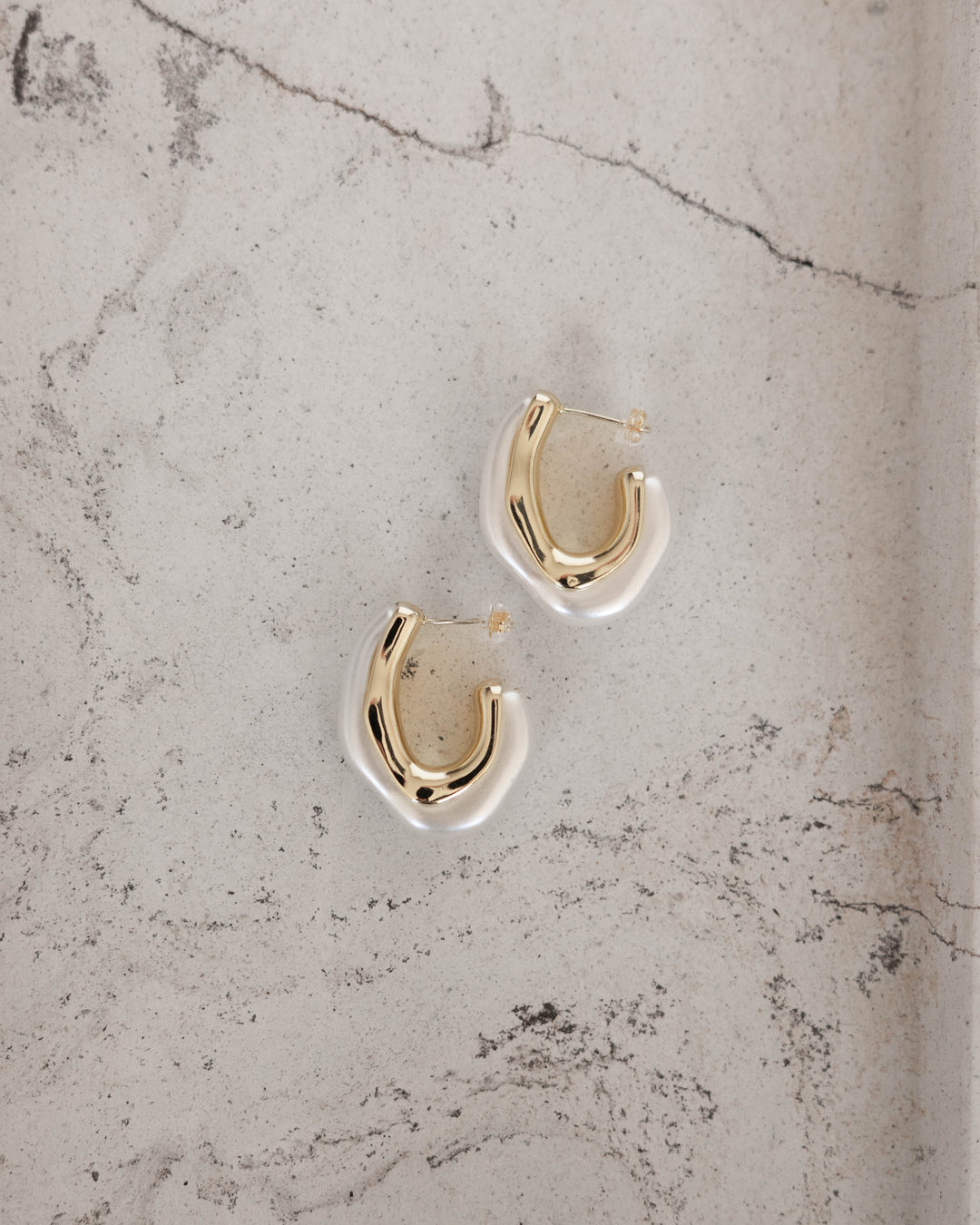 Gold plated hoop with pearl accent. 