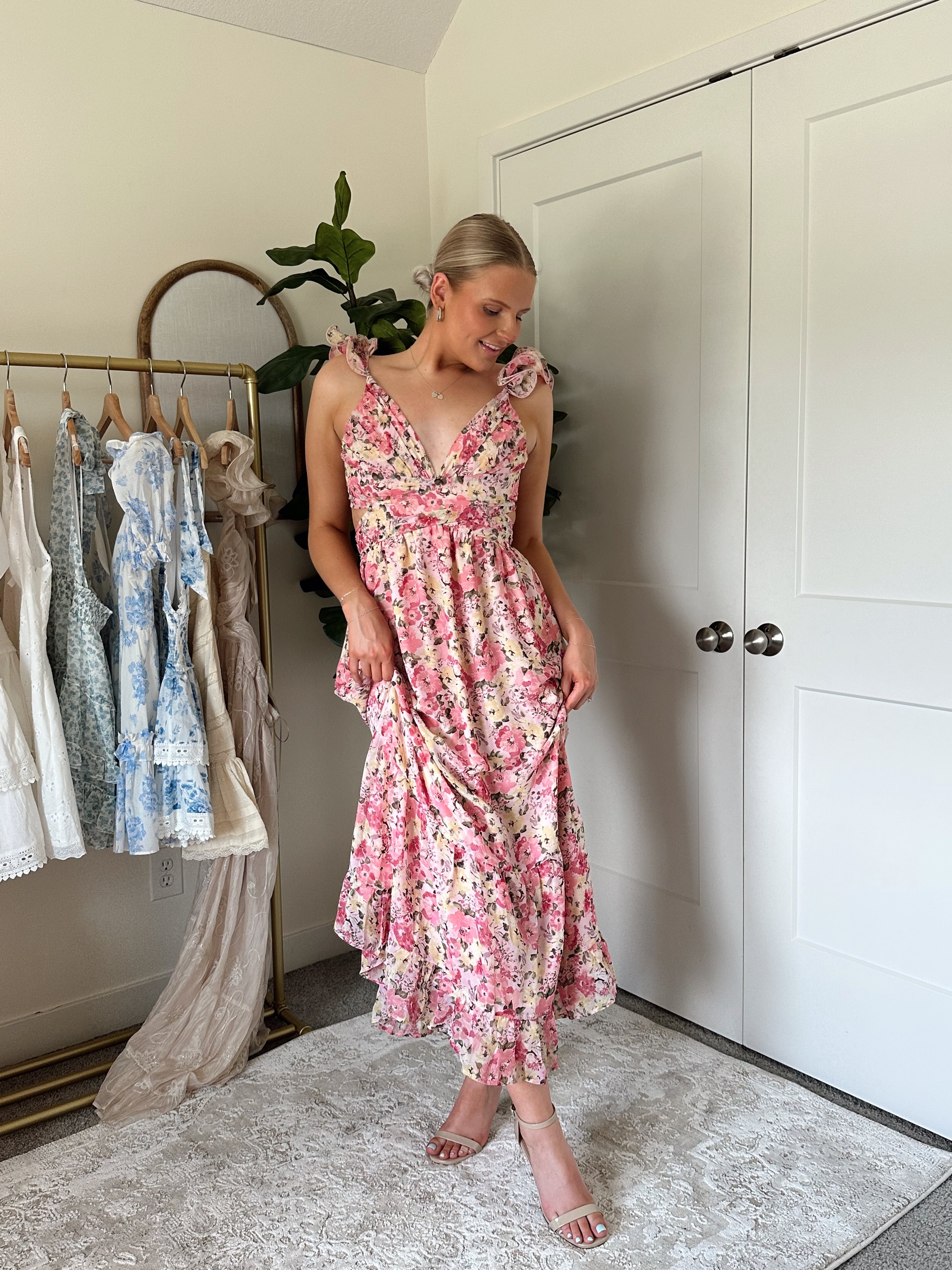 Pink and yellow floral midi dress with ruffle straps, side cutouts, and open lace-up back