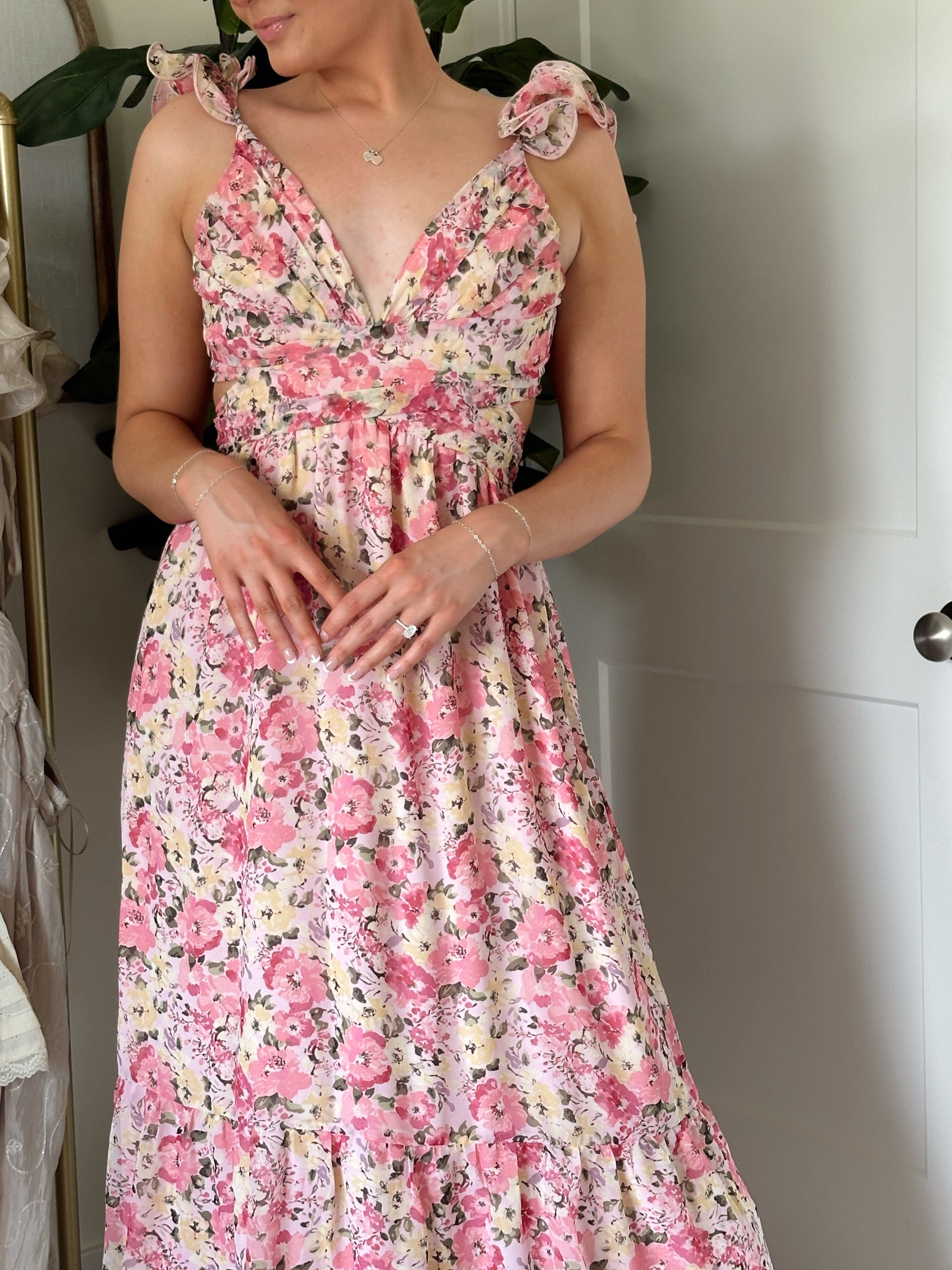 Pink and yellow floral midi dress with ruffle straps, side cutouts, and open lace-up back