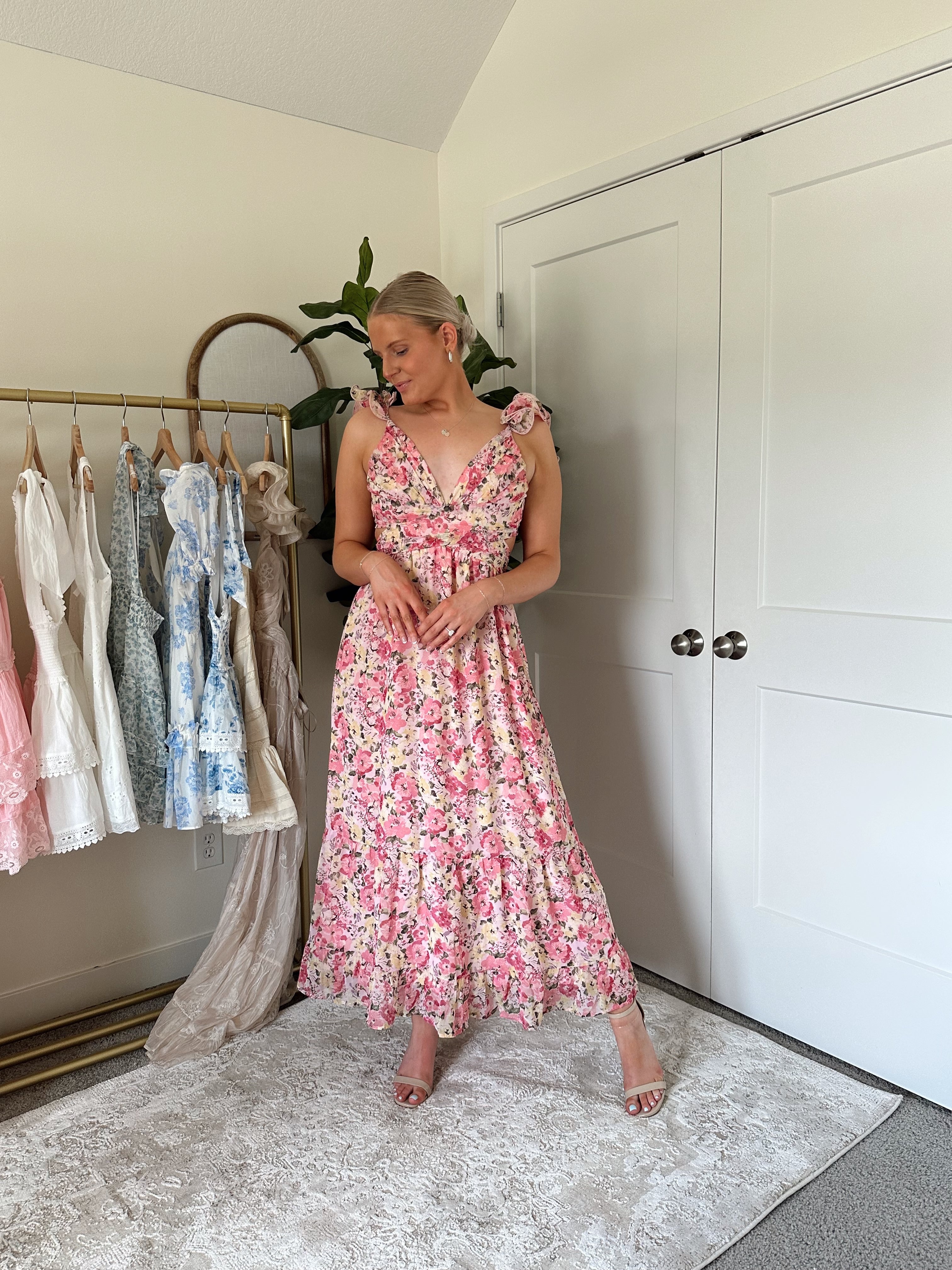 Pink and yellow floral midi dress with ruffle straps, side cutouts, and open lace-up back