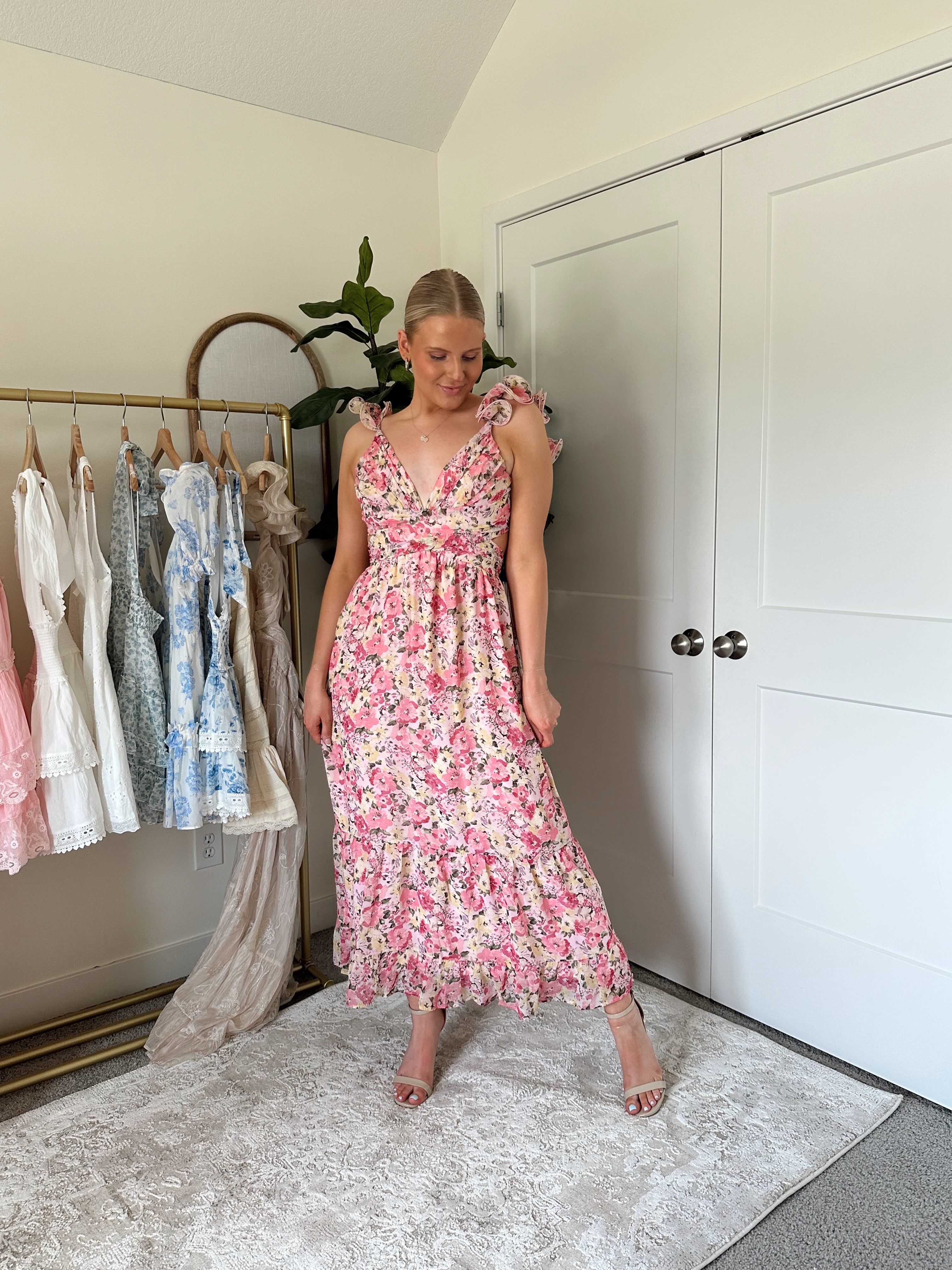 Pink and yellow floral midi dress with ruffle straps, side cutouts, and open lace-up back