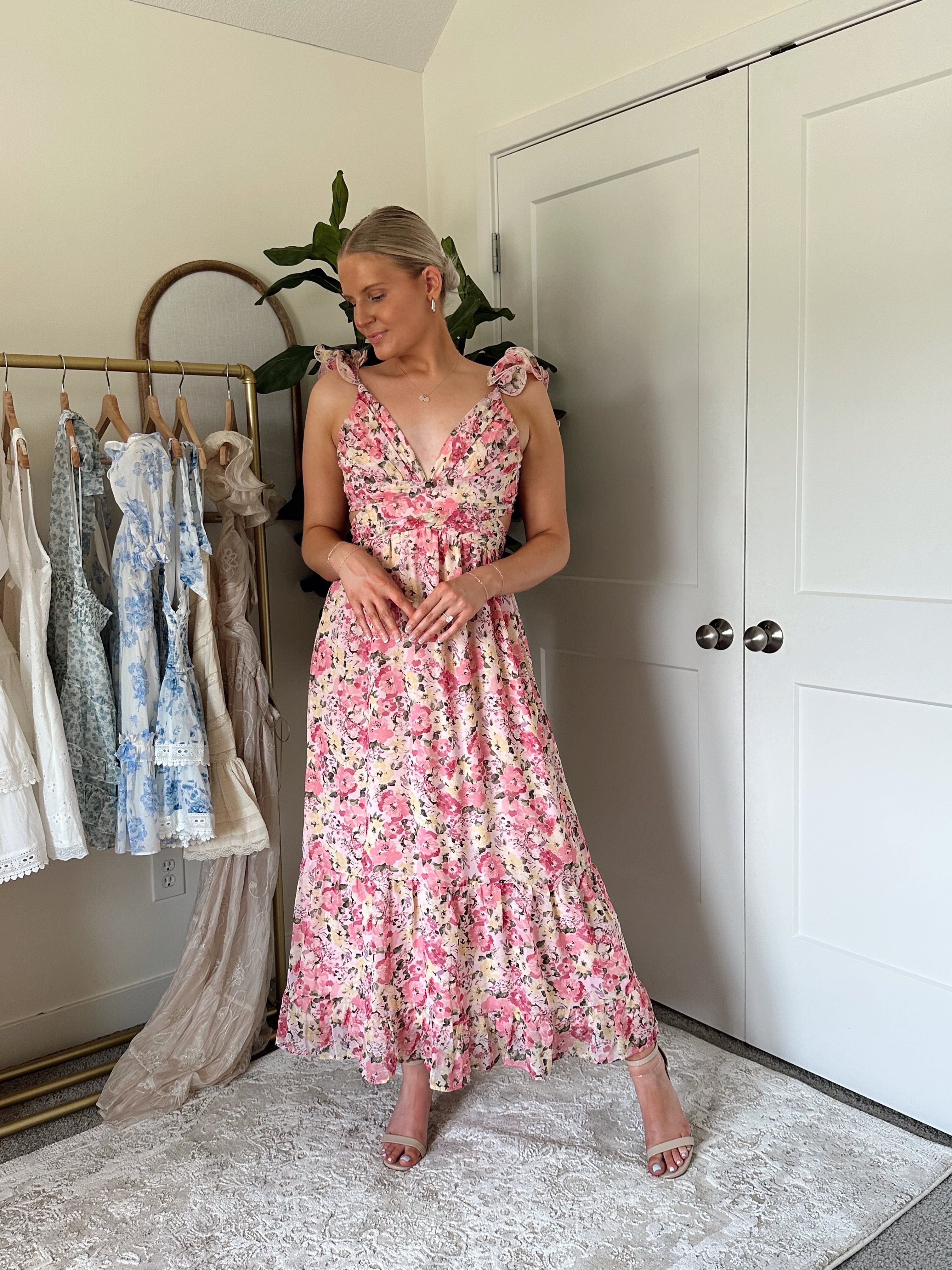 Pink and yellow floral midi dress with ruffle straps, side cutouts, and open lace-up back