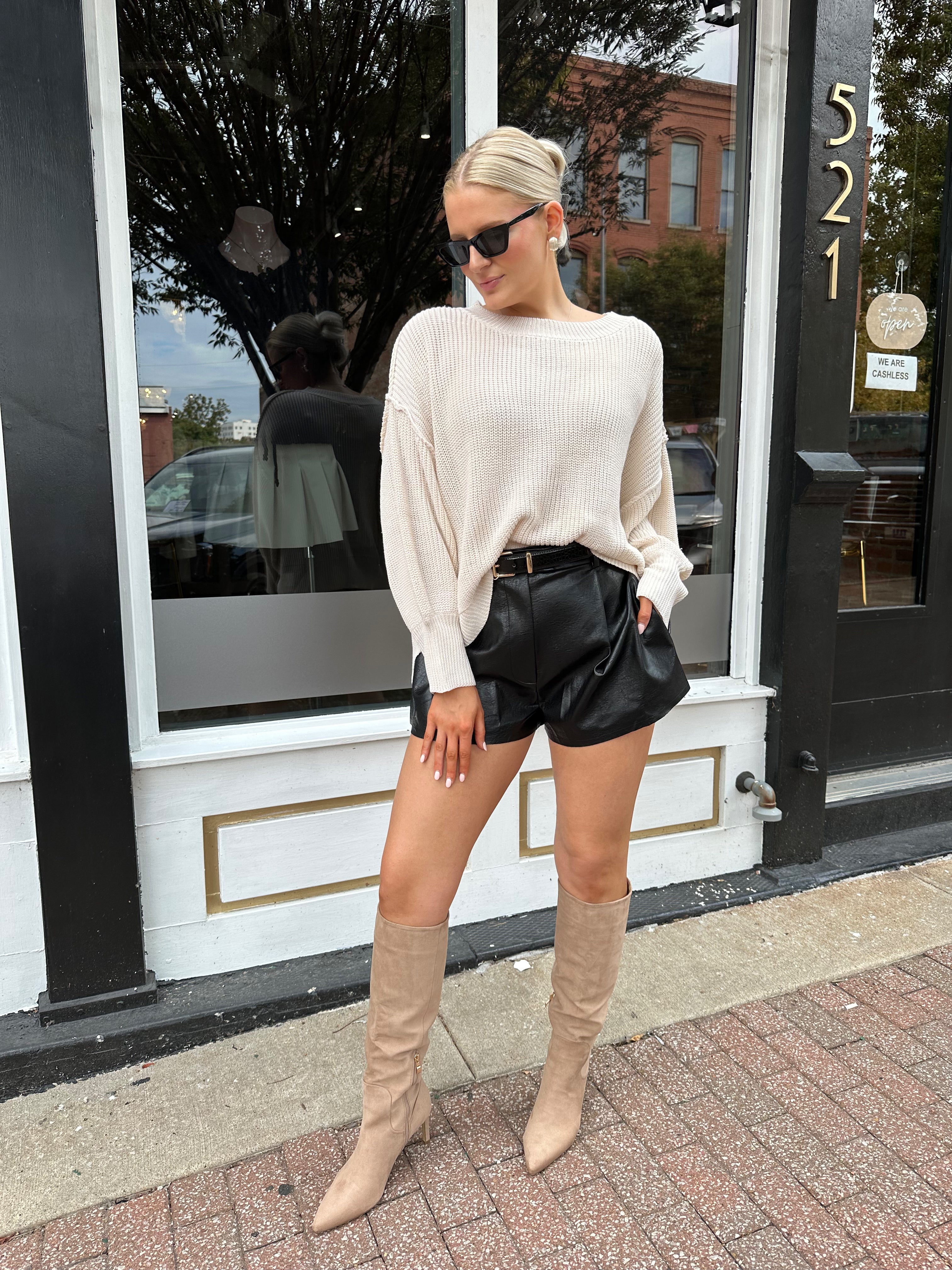 Long sleeve ivory waffle knit sweater with over sized fit. 