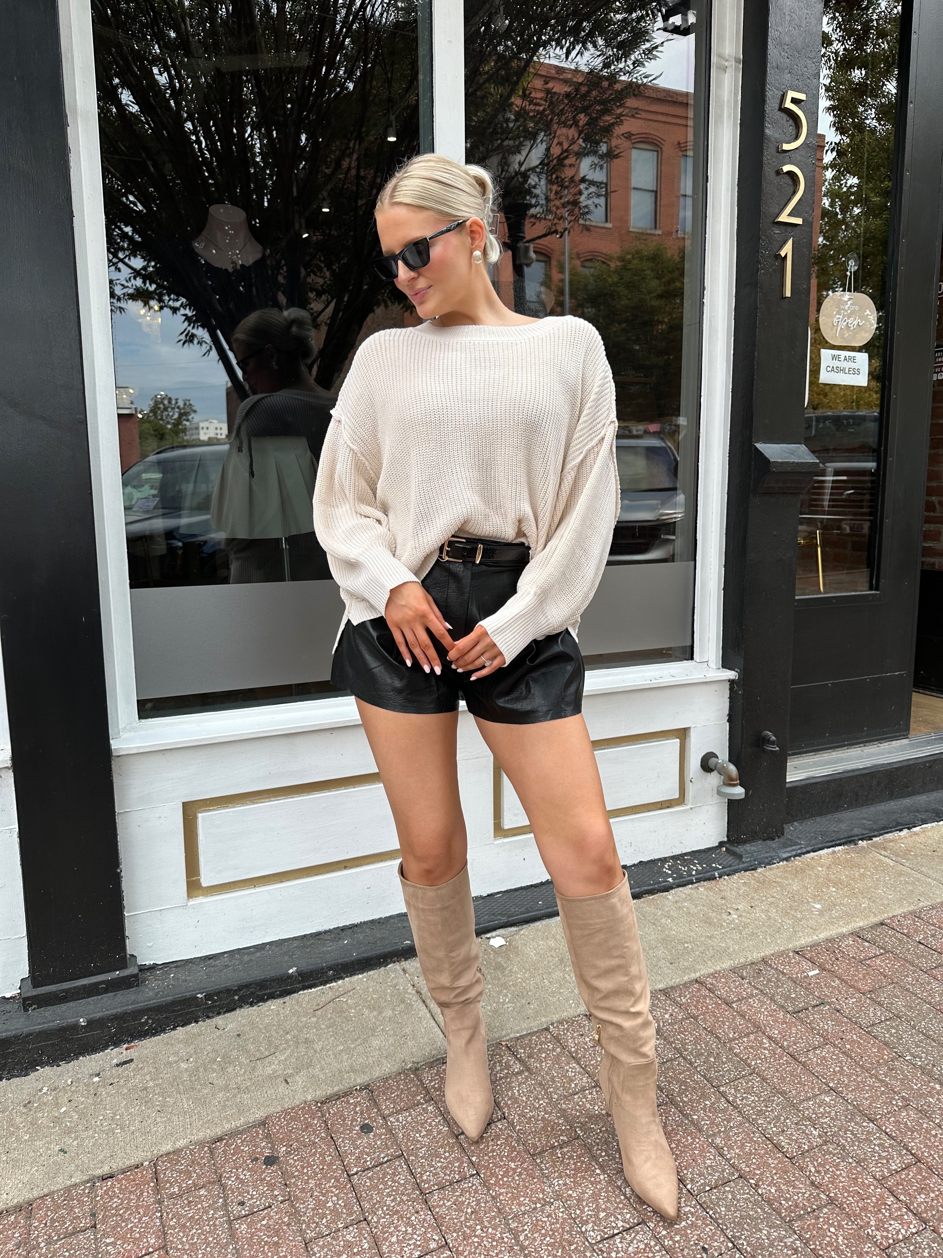 Long sleeve ivory waffle knit sweater with over sized fit. 
