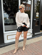 Long sleeve ivory waffle knit sweater with over sized fit. 