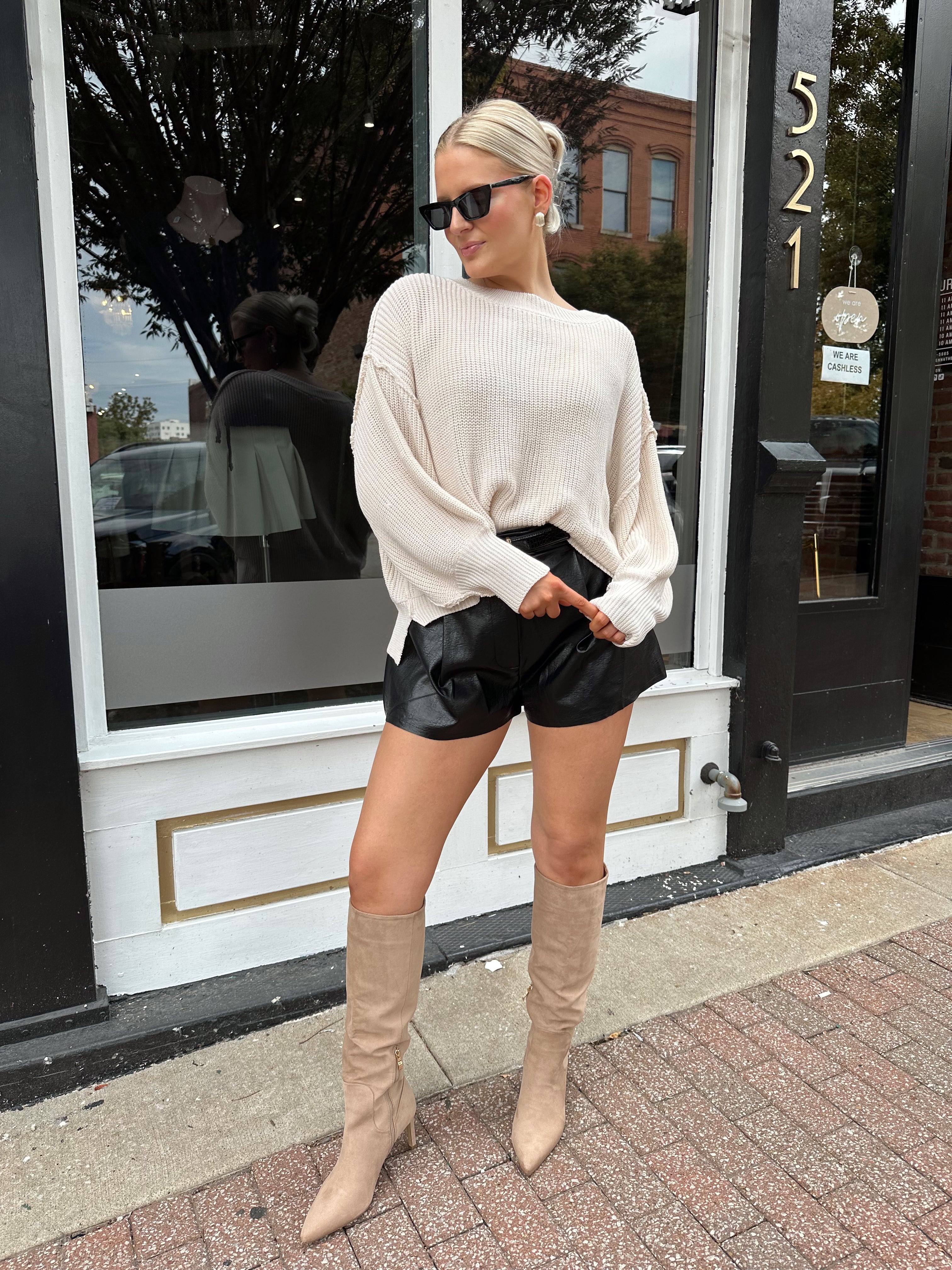 Long sleeve ivory waffle knit sweater with over sized fit. 