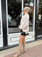 Long sleeve ivory waffle knit sweater with over sized fit. 