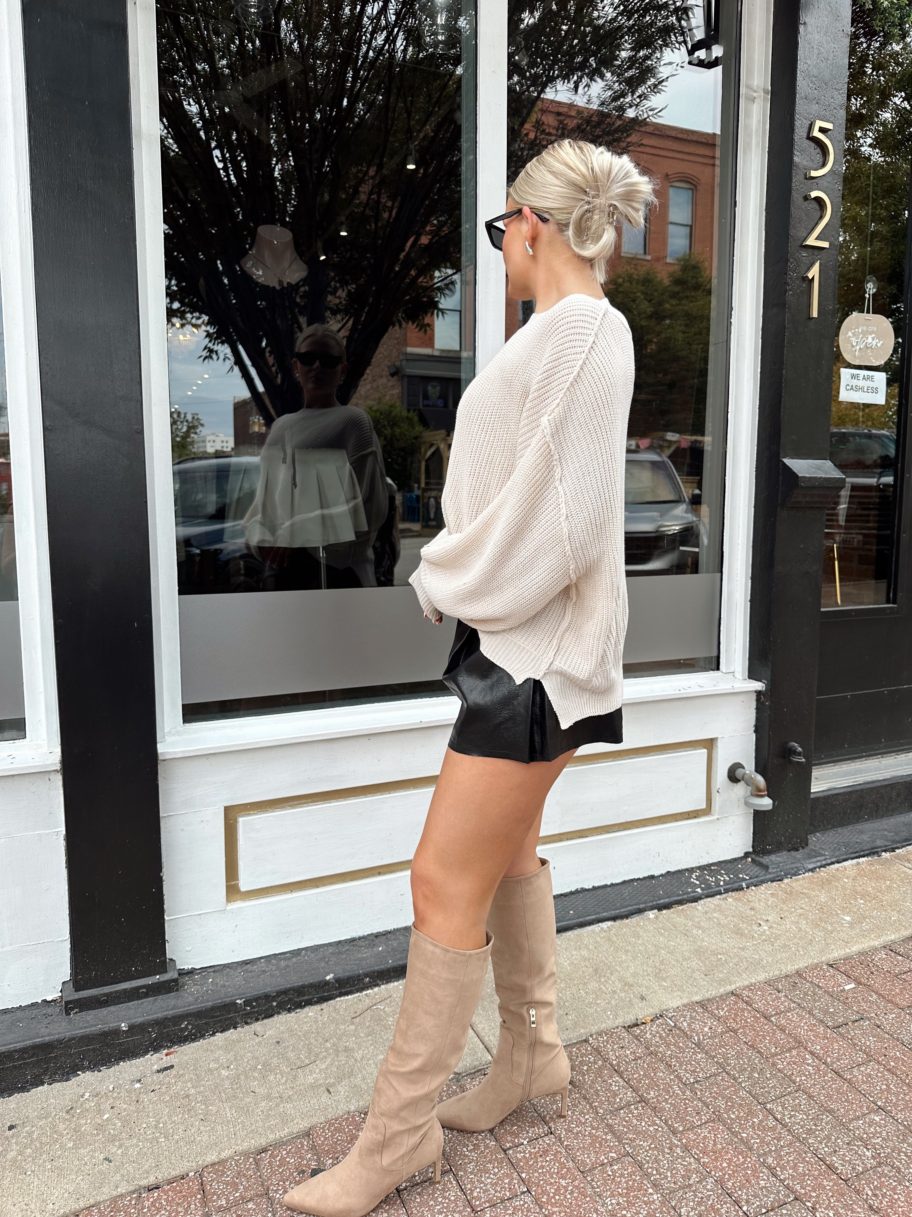 Long sleeve ivory waffle knit sweater with over sized fit. 