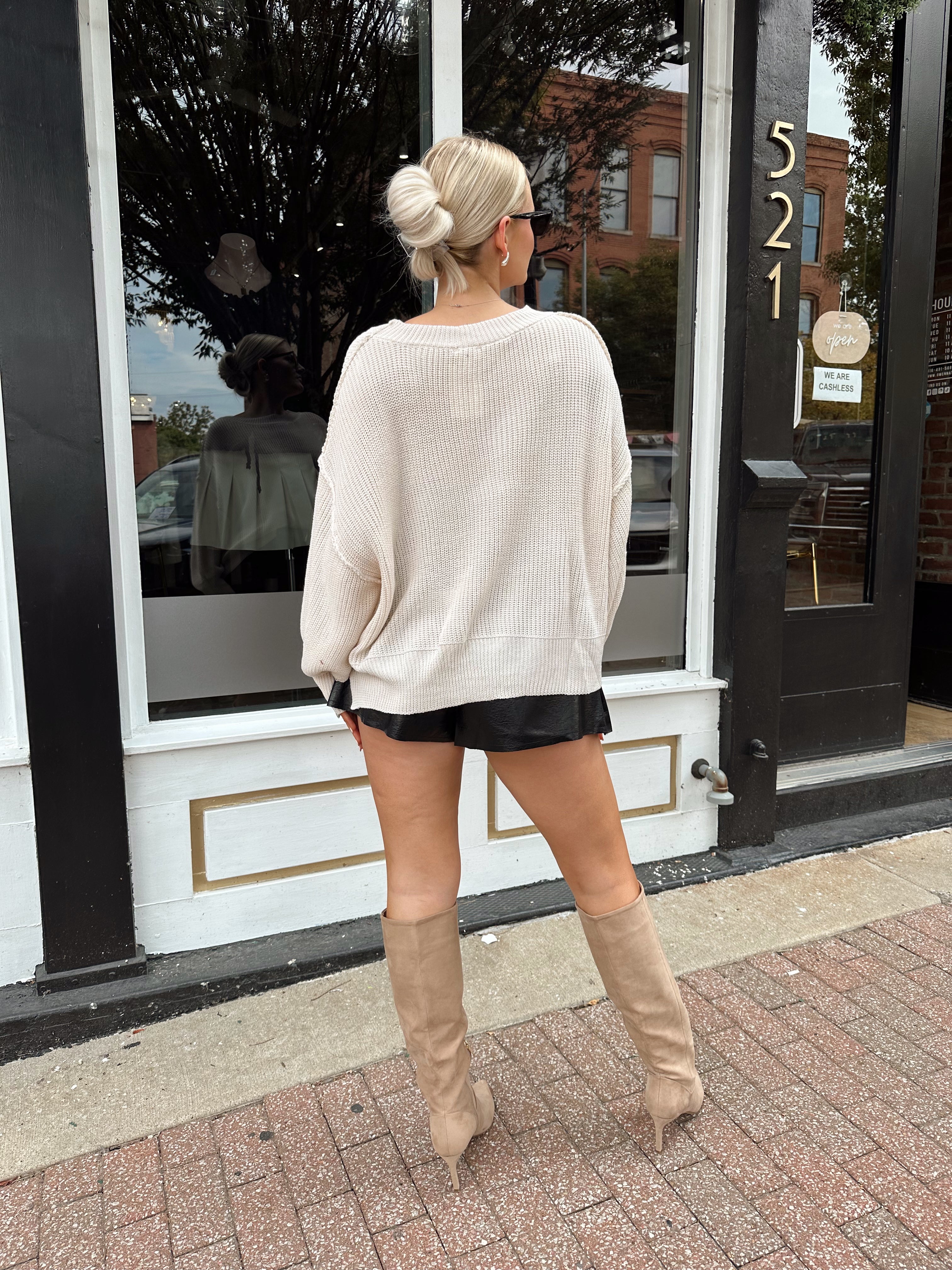 Long sleeve ivory waffle knit sweater with over sized fit. 