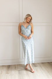 Blue floral satin midi dress with lace trim. Adjustable spaghetti straps.