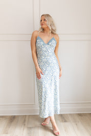 Blue floral satin midi dress with lace trim. Adjustable spaghetti straps.