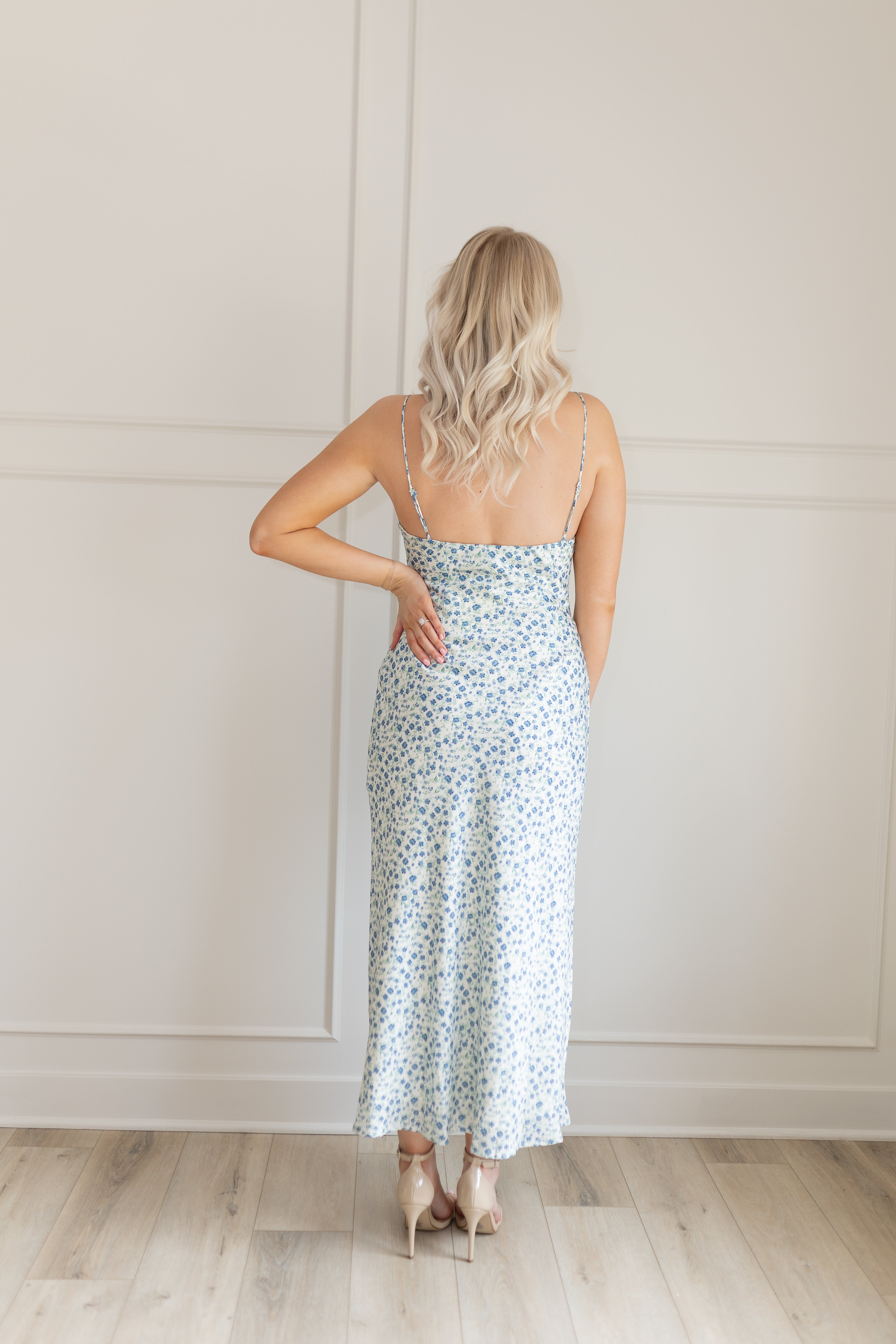 Blue floral satin midi dress with lace trim. Adjustable spaghetti straps.