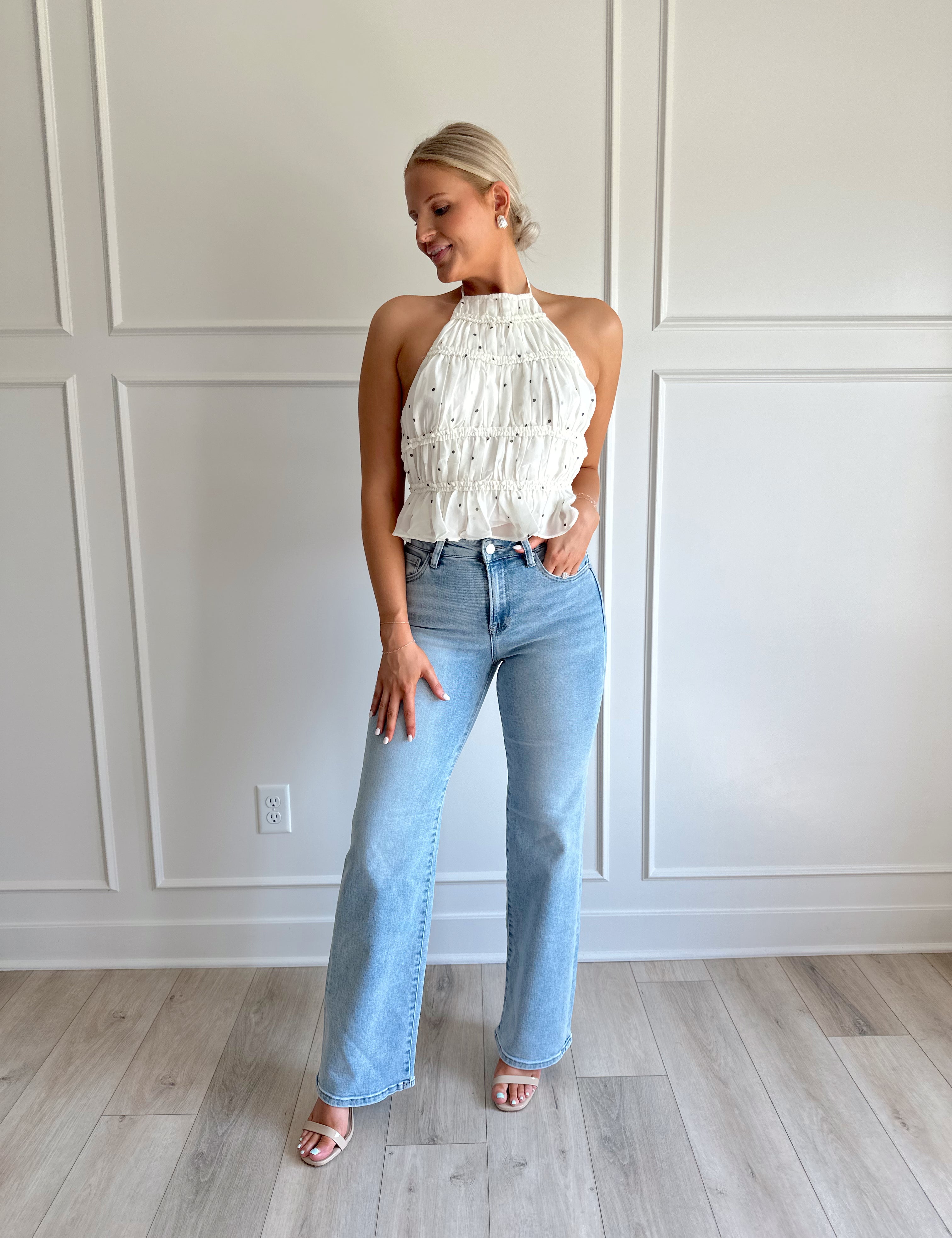 White polka dot tiered halter neck top with open back.