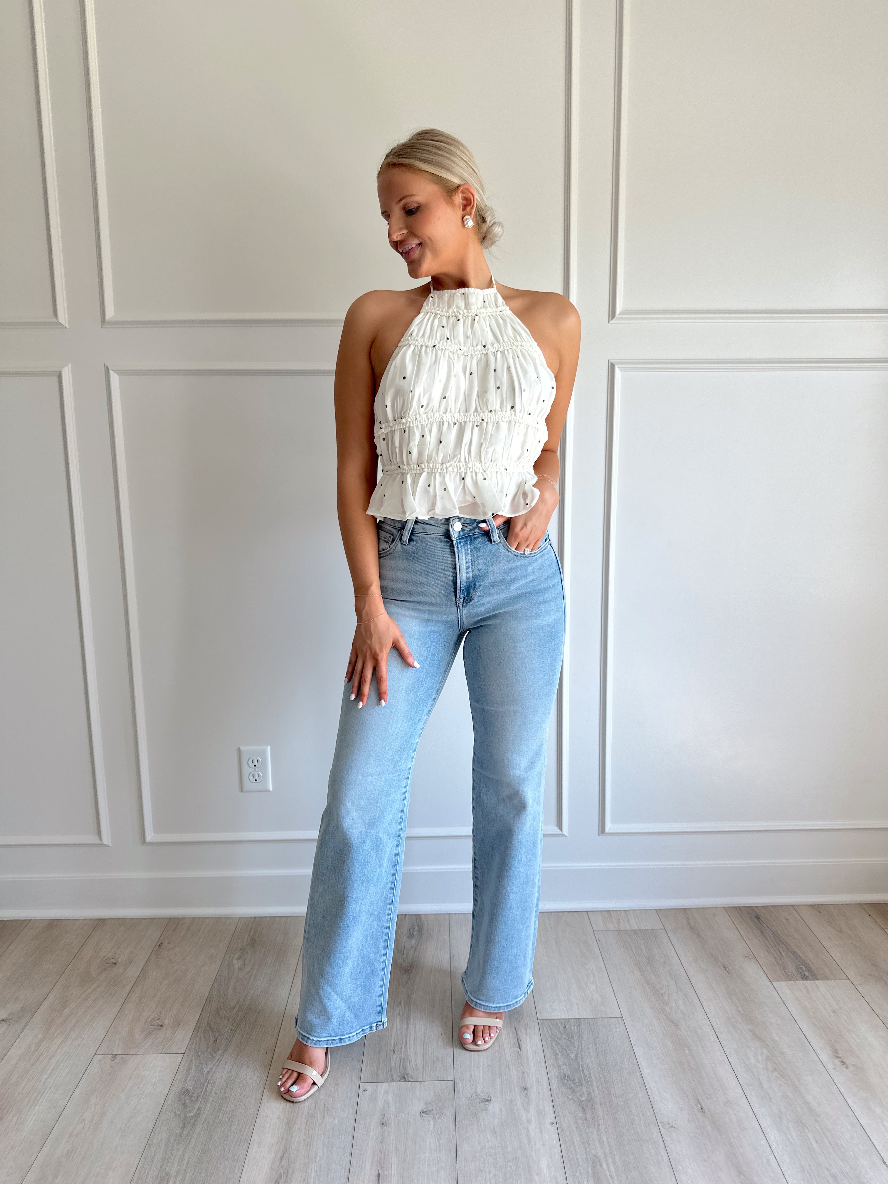 White polka dot tiered halter neck top with open back.