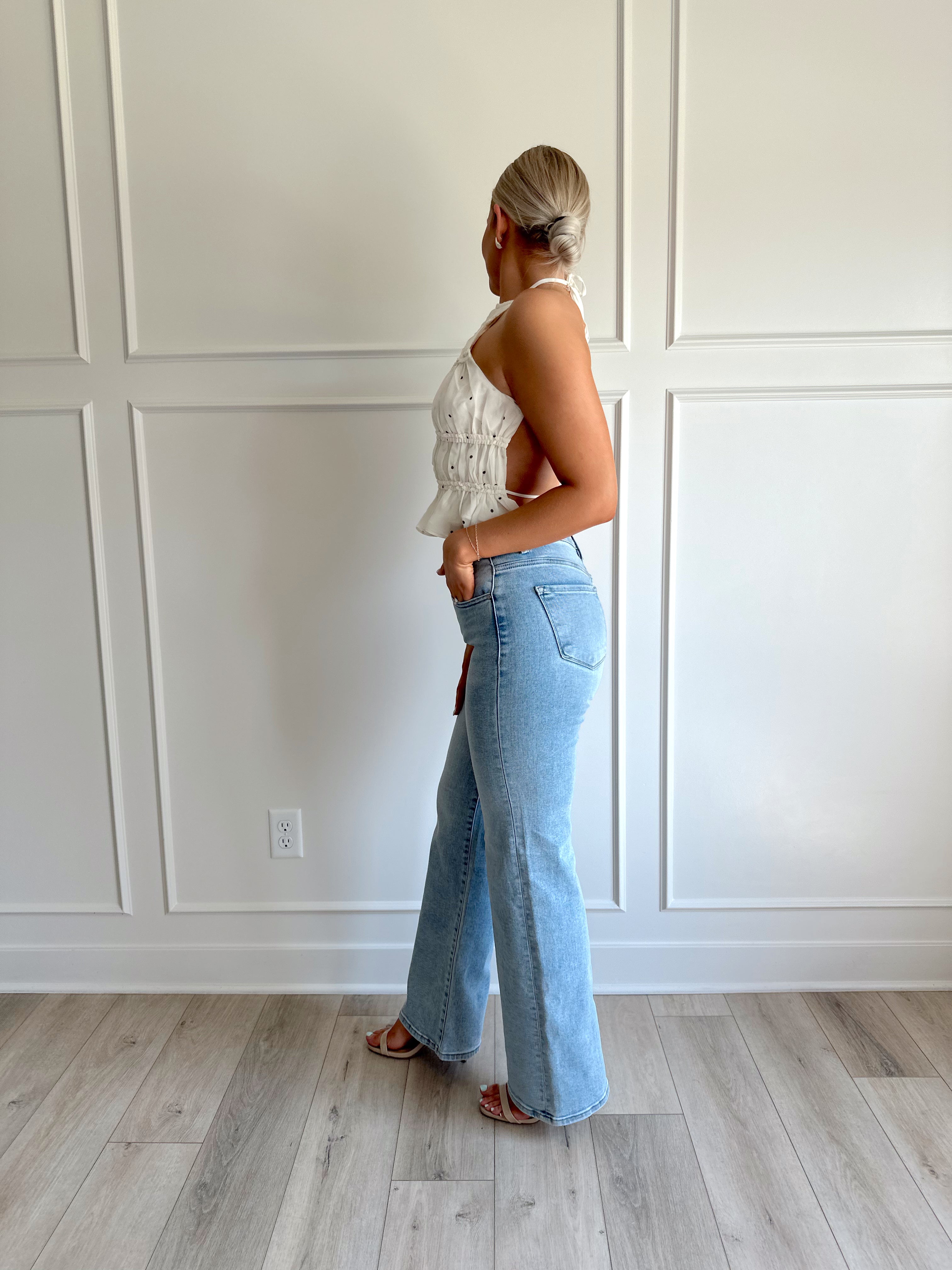 White polka dot tiered halter neck top with open back.