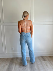 White polka dot tiered halter neck top with open back.