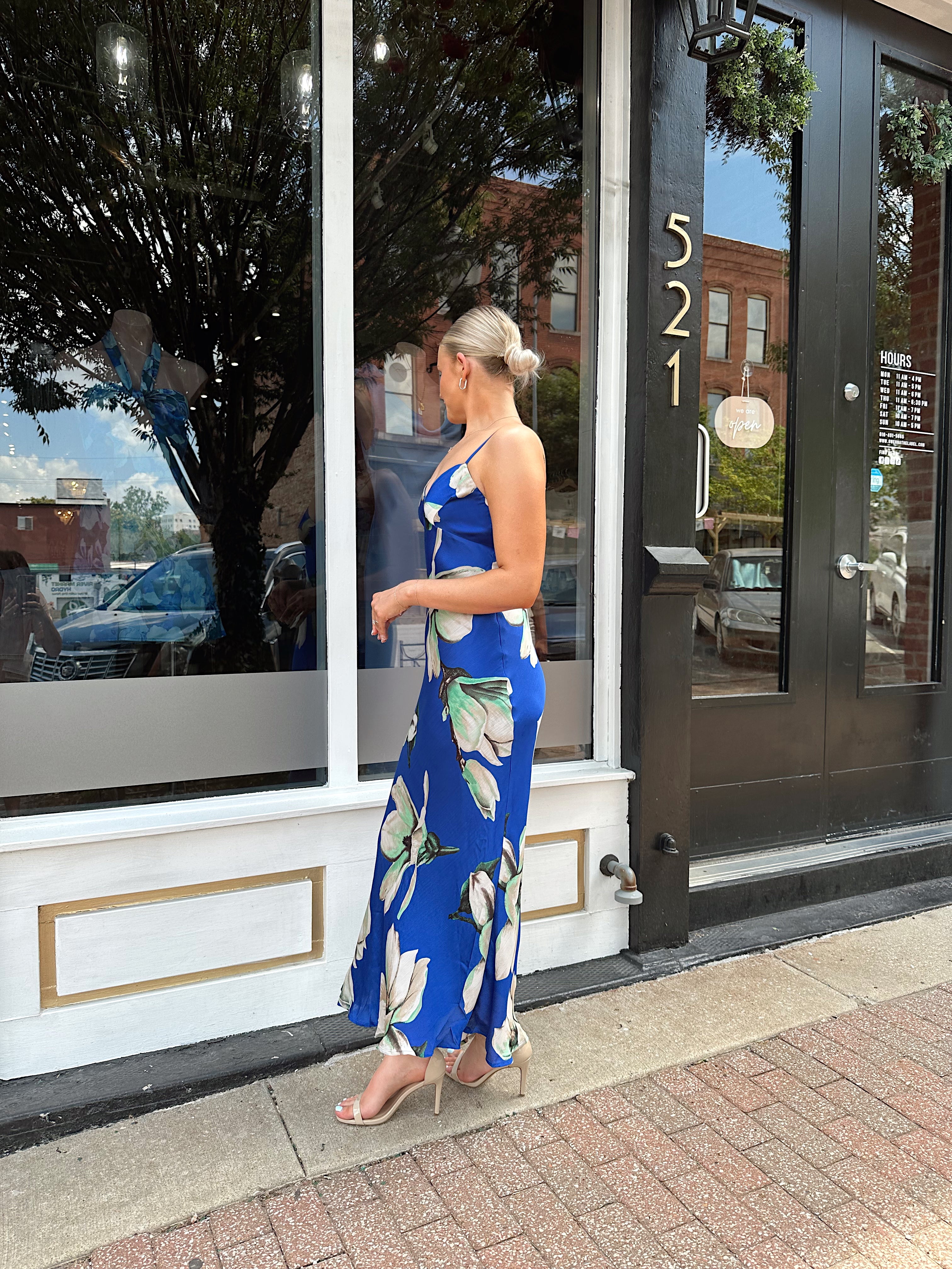 Royal blue satin midi dress with floral pattern.
