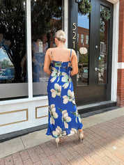 Royal blue satin midi dress with floral pattern.