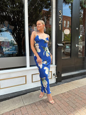 Royal blue satin midi dress with floral pattern.