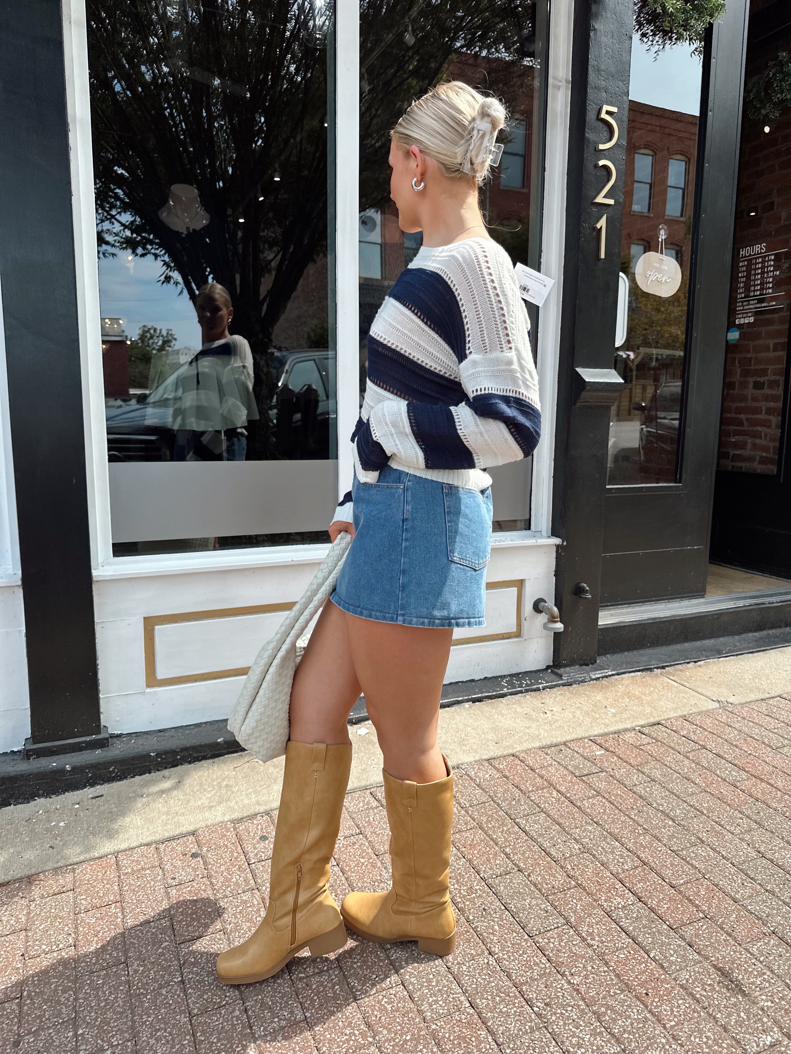 Navy and ivory striped knit long sleeve top. 