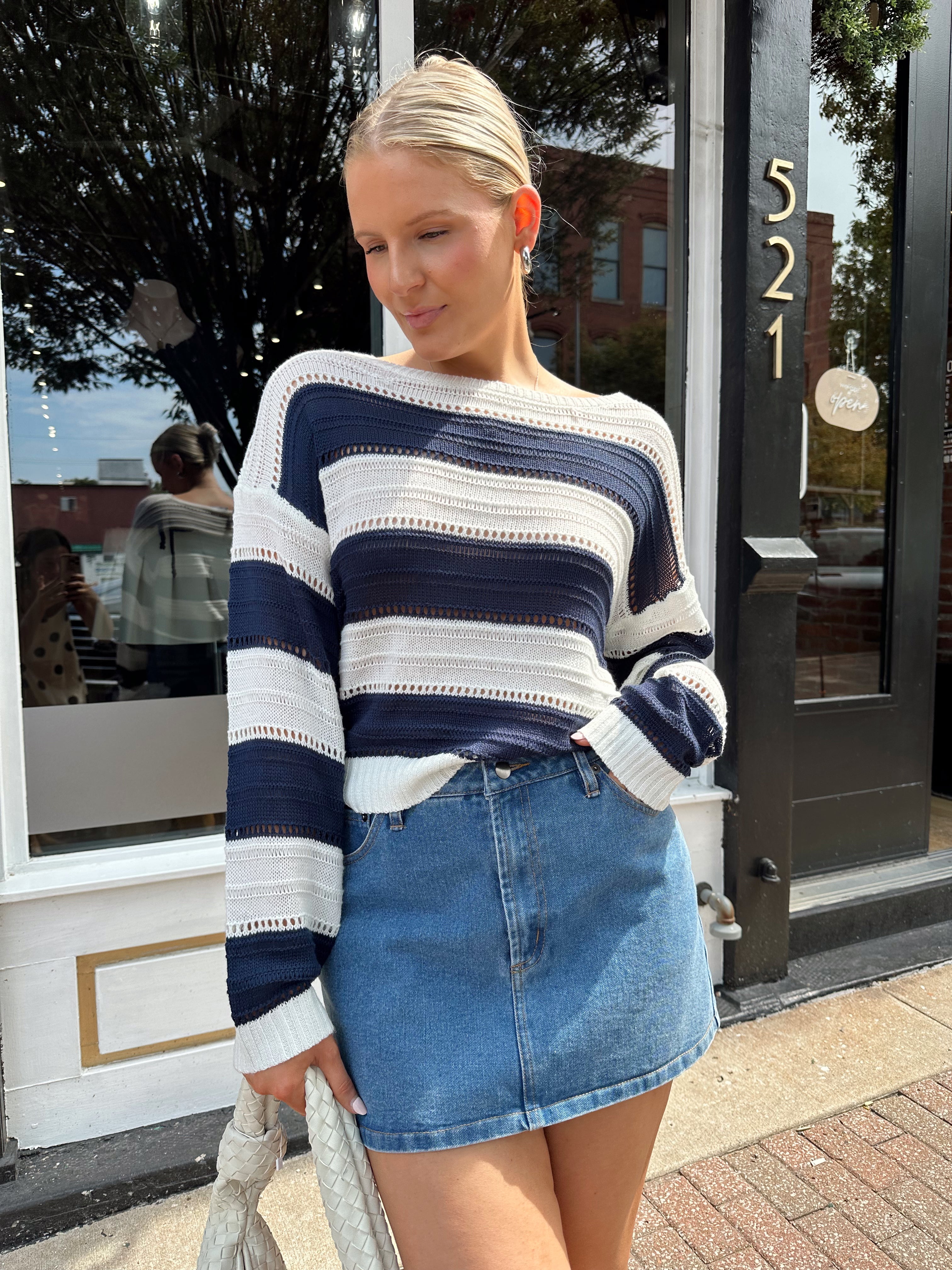 Navy and ivory striped knit long sleeve top. 