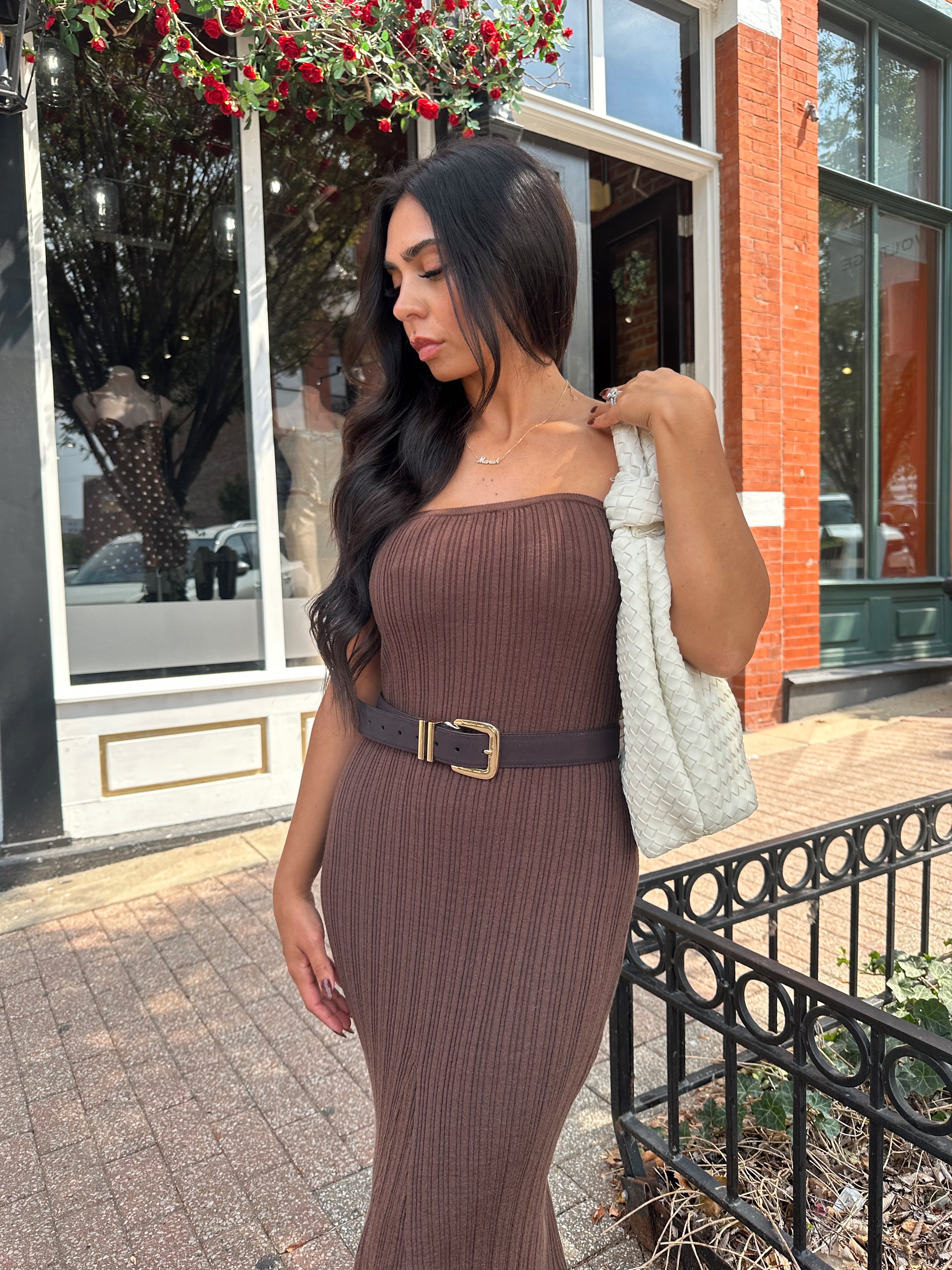 Woman wearing dark brown textured strapless maxi dress. Perfect for fall.