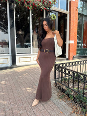 Woman wearing dark brown textured strapless maxi dress. Perfect for fall.