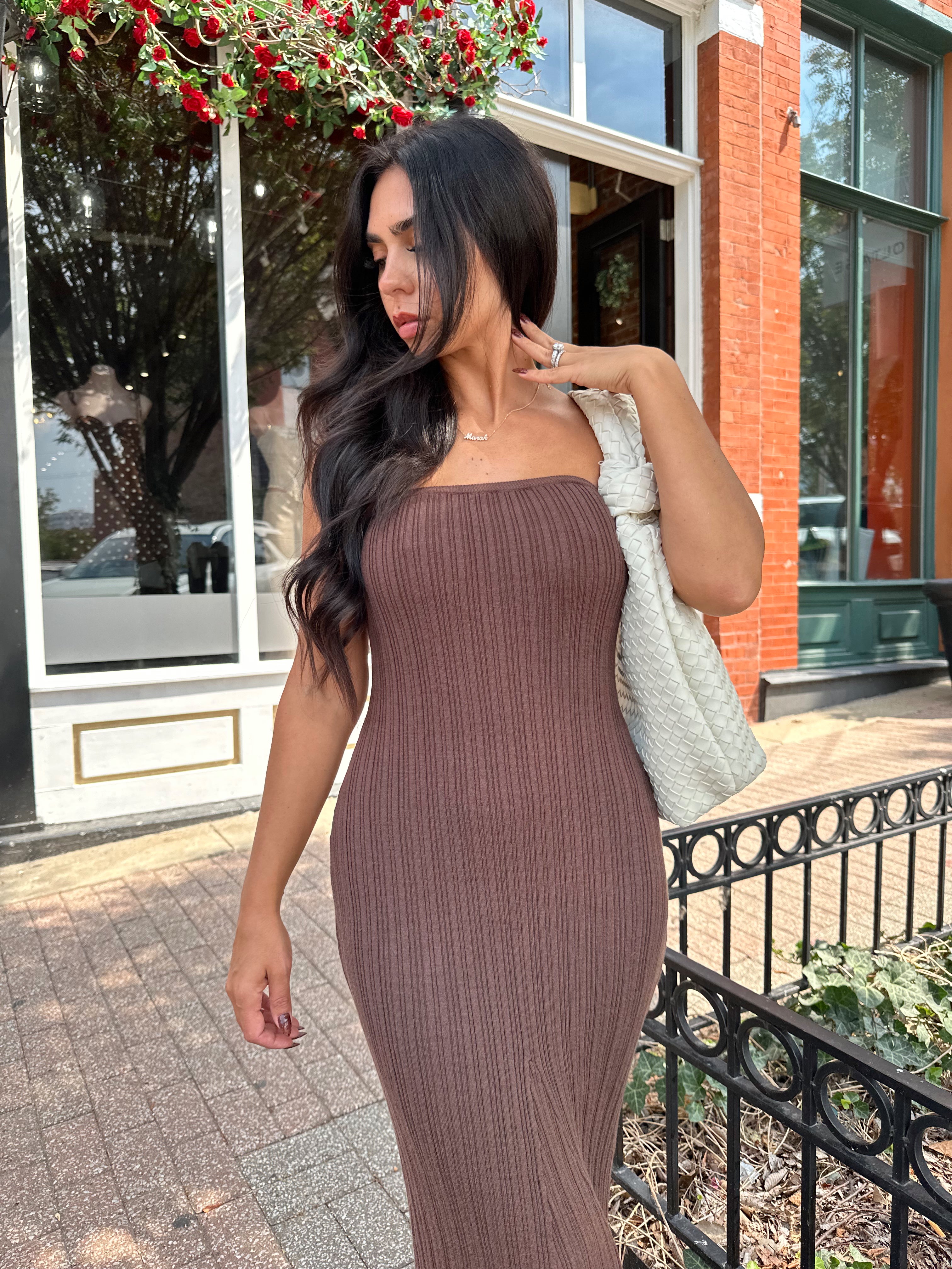 Woman wearing dark brown textured strapless maxi dress. Perfect for fall.