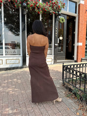 Woman wearing dark brown textured strapless maxi dress. Perfect for fall.