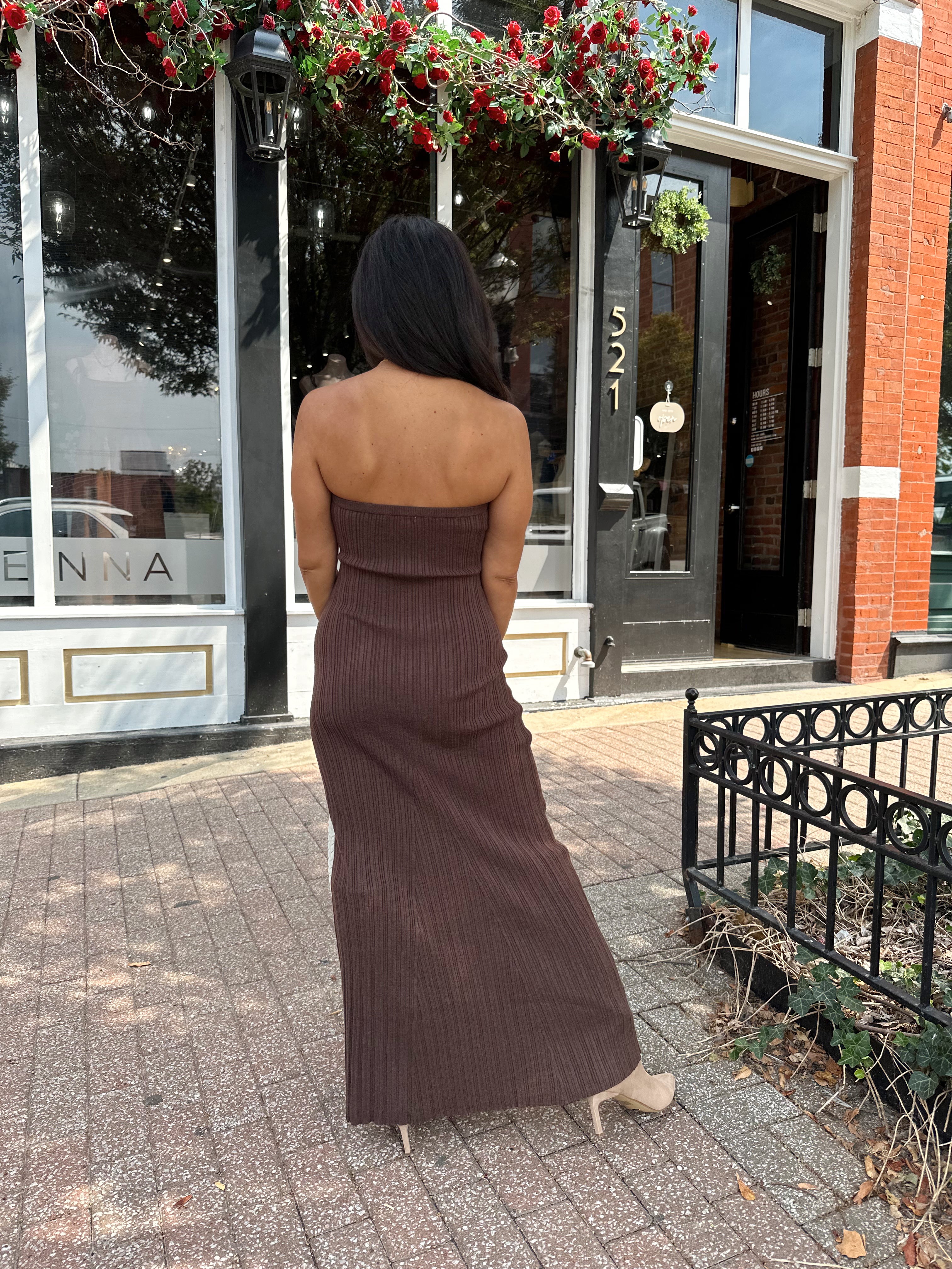 Woman wearing dark brown textured strapless maxi dress. Perfect for fall.