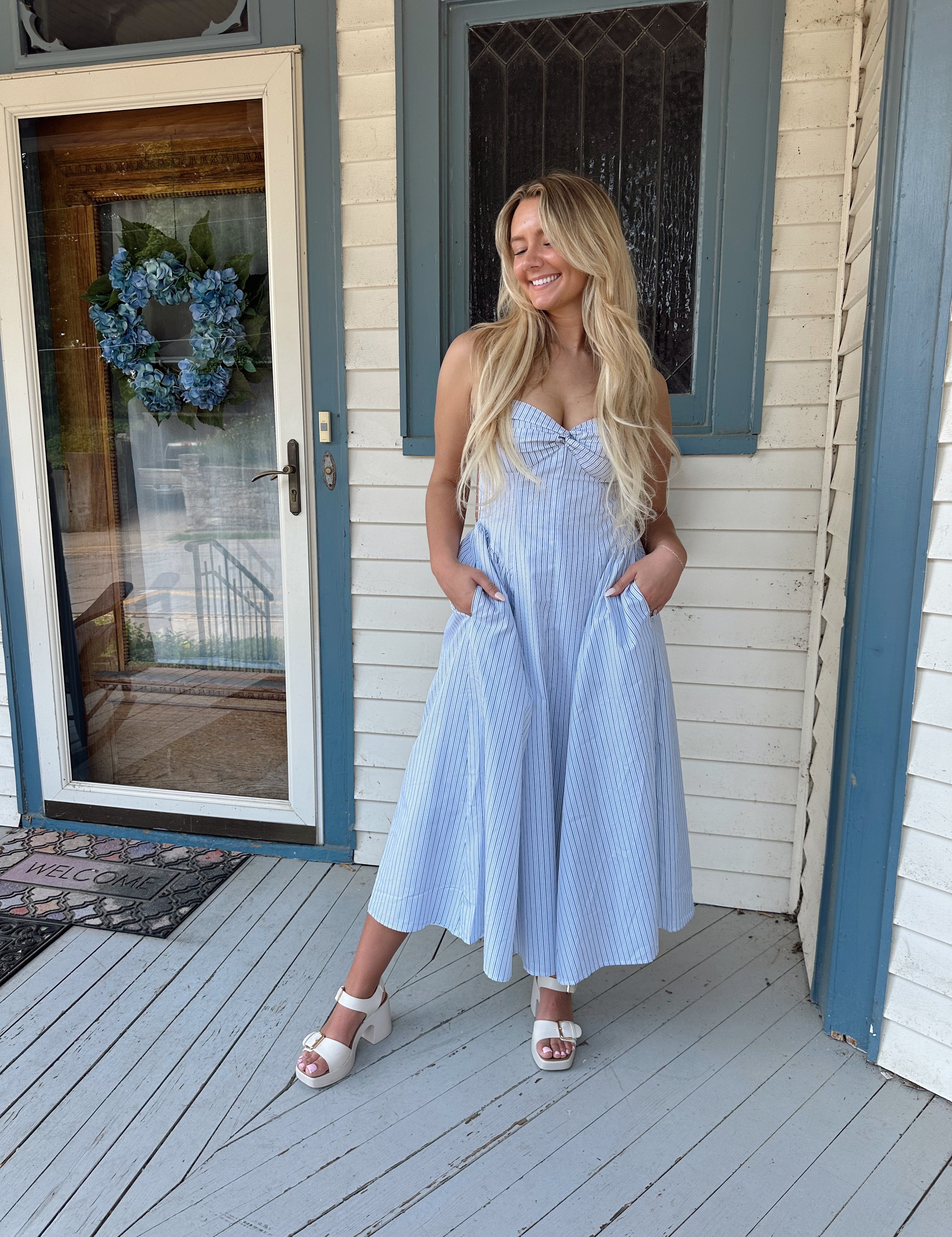 White and blue pinstripe drop waist midi dress with an open back