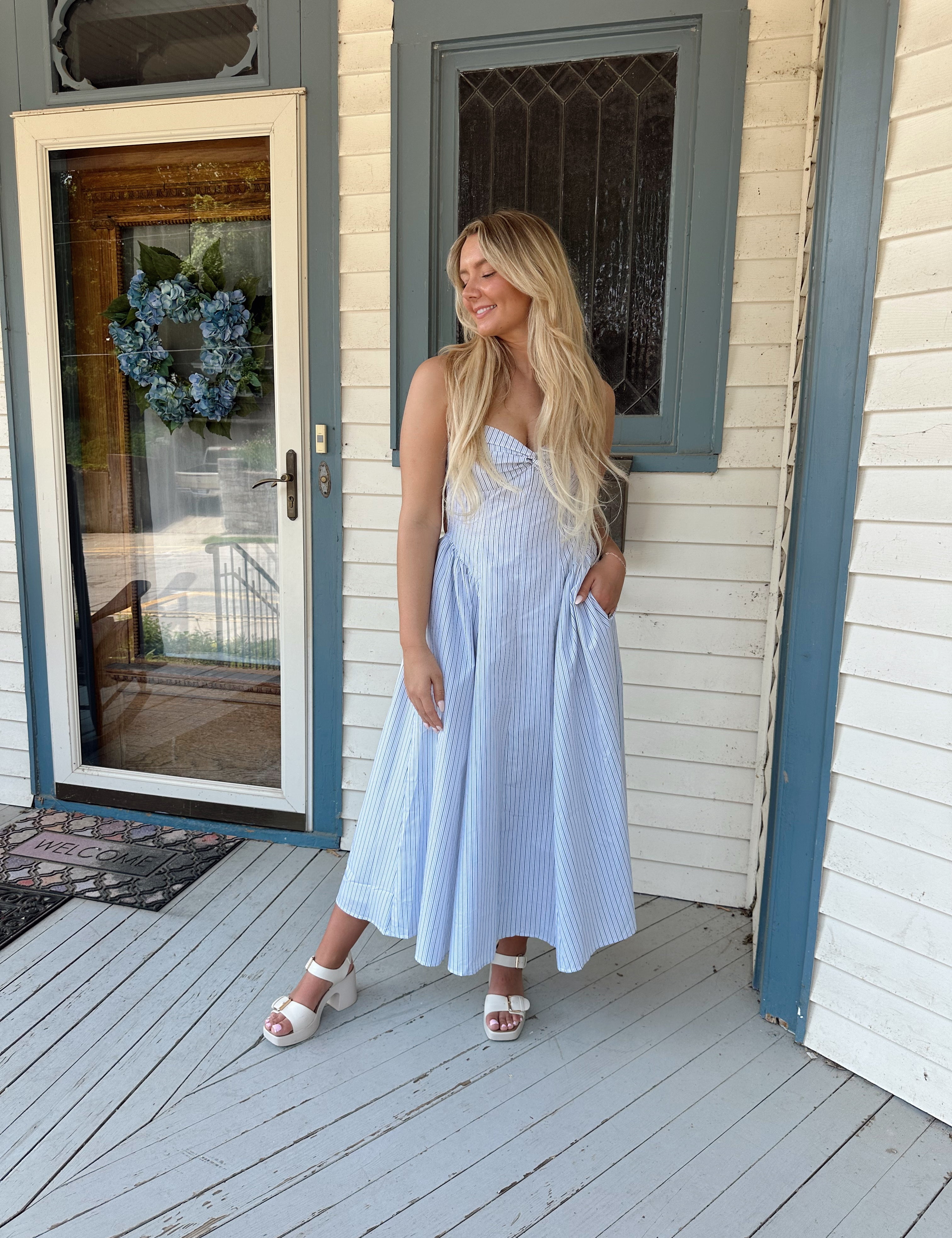 White and blue pinstripe drop waist midi dress with an open back