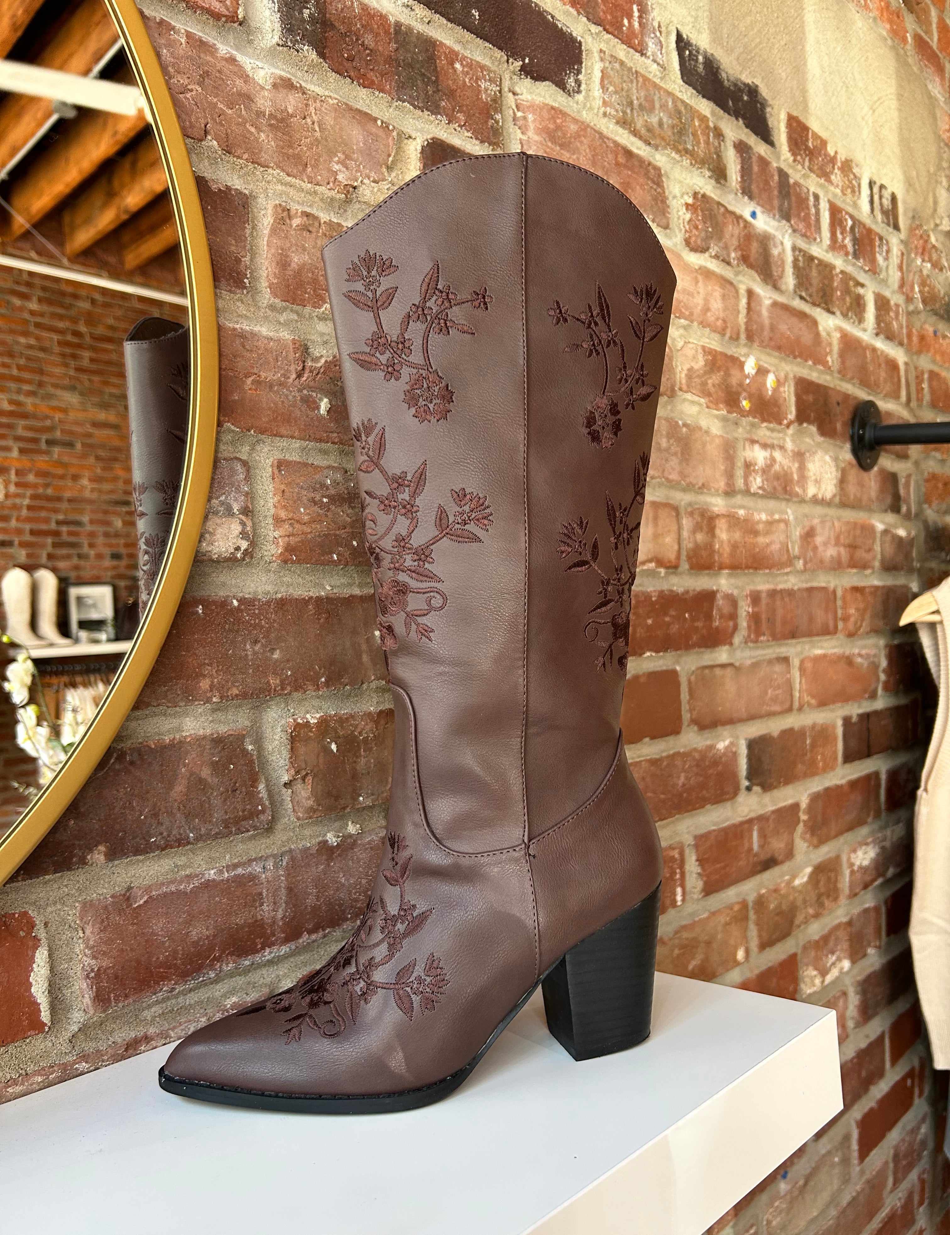 Dark brown Western boot with floral embroidery, pointed toe, and stacked block heel