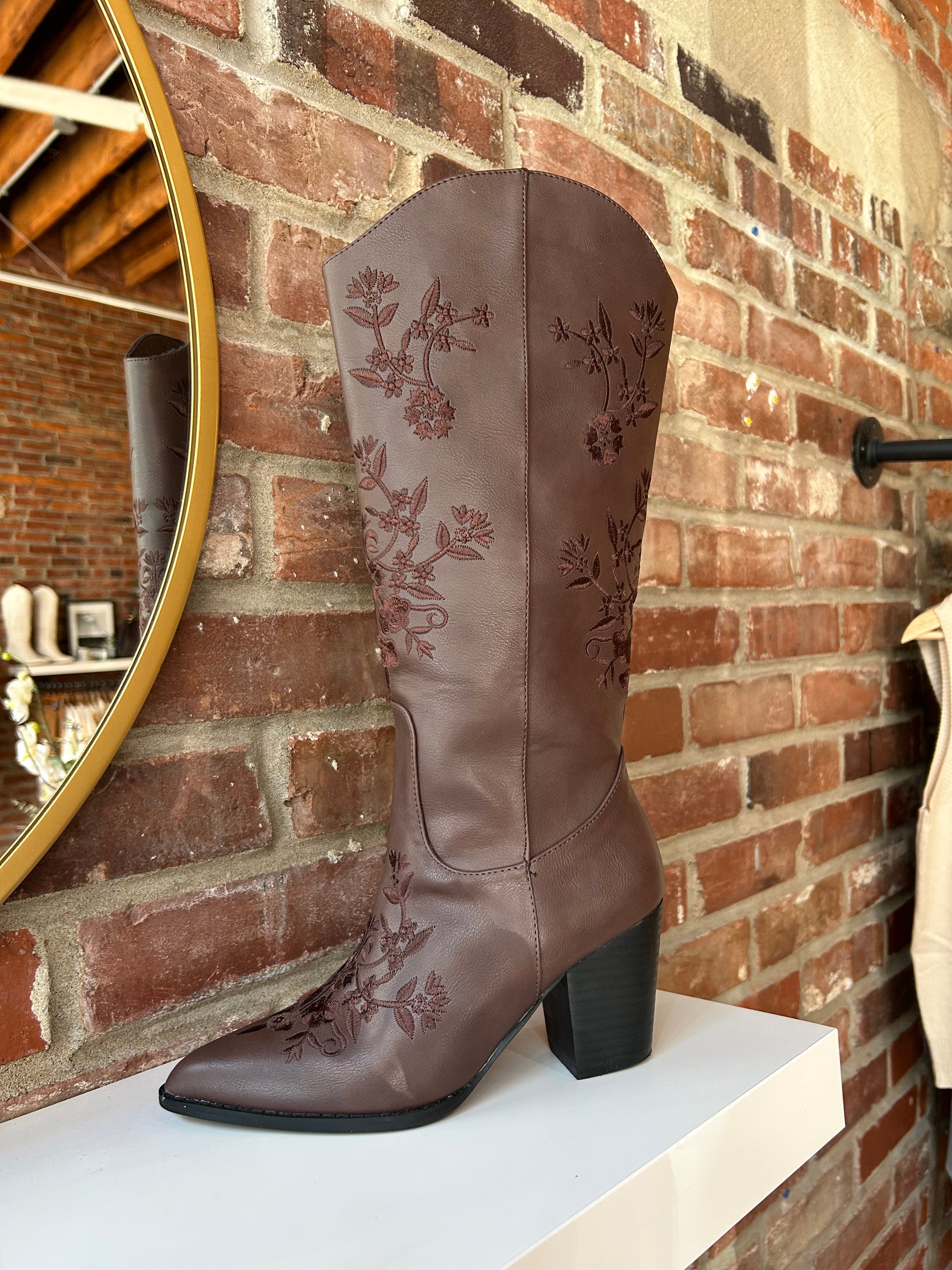 Dark brown Western boot with floral embroidery, pointed toe, and stacked block heel